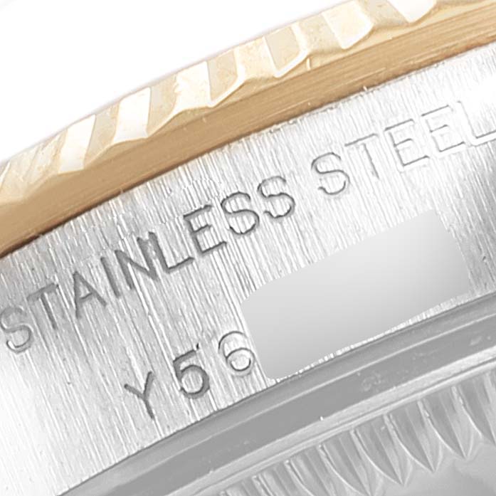 The image shows a close-up of the side of the bezel and case back of a Rolex Oyster Perpetual 76193 Women's Steel and Gold (two tone) Grey Dial 76193 Women's Steel and Gold (two tone) Grey Dial watch, displaying text indicating "STAINLESS STEEL."