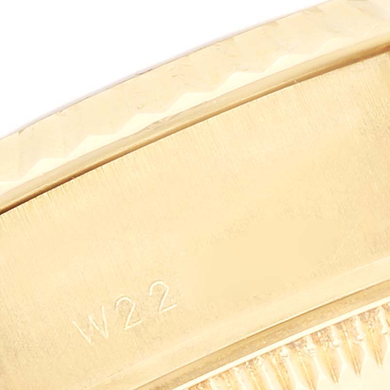 This close-up image shows the side of a Rolex President 69178 Women
s Yellow Gold Champagne Dial 69178 Women
s Yellow Gold Champagne Dial watch case, focusing on the edge and fine detailing.