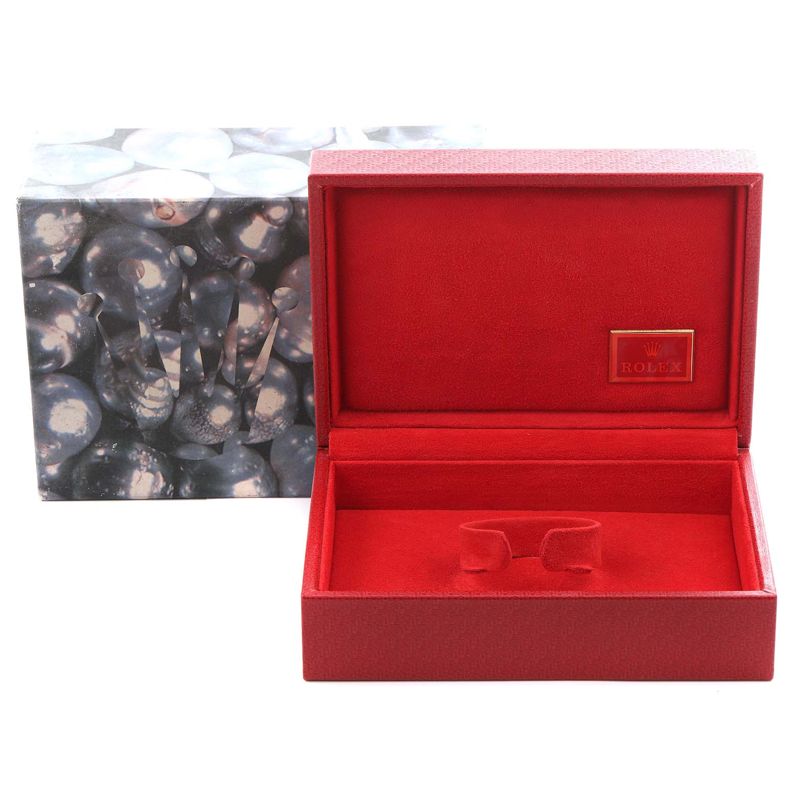 The image shows a red Rolex watch box, open to display its interior, with a decorative outer box featuring the Rolex crown logo.