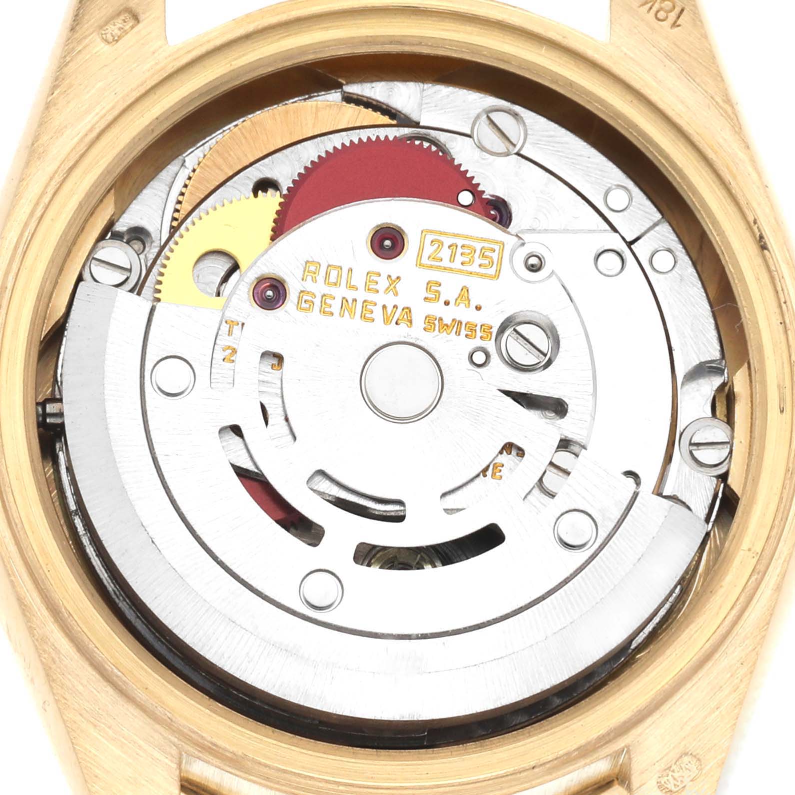 The image shows the movement of a Rolex President 69088 Women
s Yellow Gold Champagne Dial 69088 Women
s Yellow Gold Champagne Dial watch, viewed from the back, revealing gears and components.