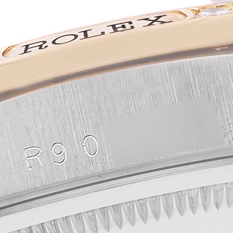 The image shows a close-up of the engraved bezel edge and case side of a Rolex President 18349 Men
s White Gold Champagne Dial 18349 Men
s White Gold Champagne Dial watch.