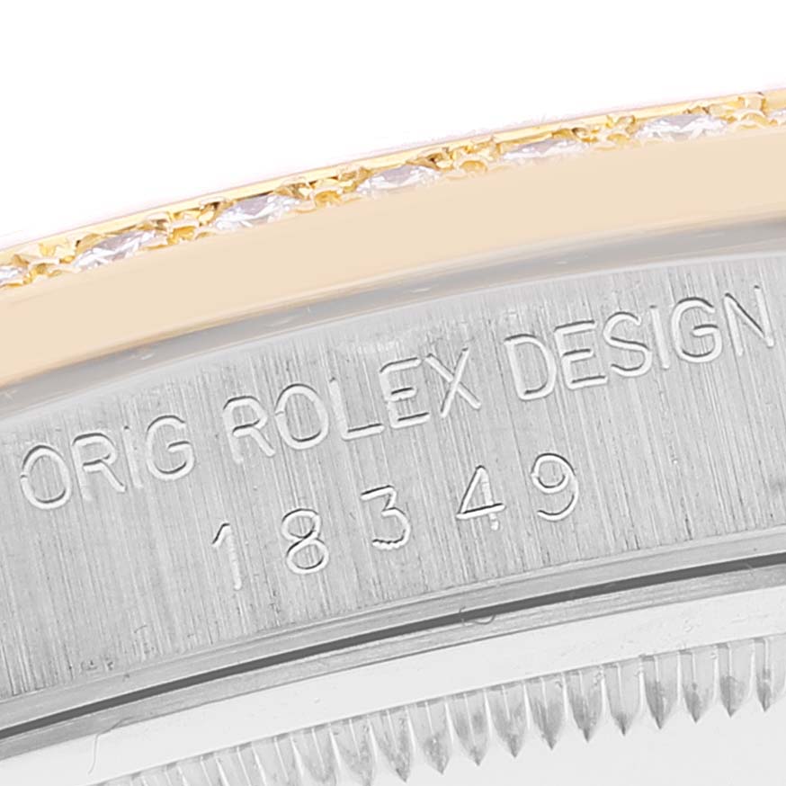 The image shows a close-up of the side of a Rolex President 18349 Men
s White Gold Champagne Dial 18349 Men
s White Gold Champagne Dial model, featuring the case edge and part of the bezel.