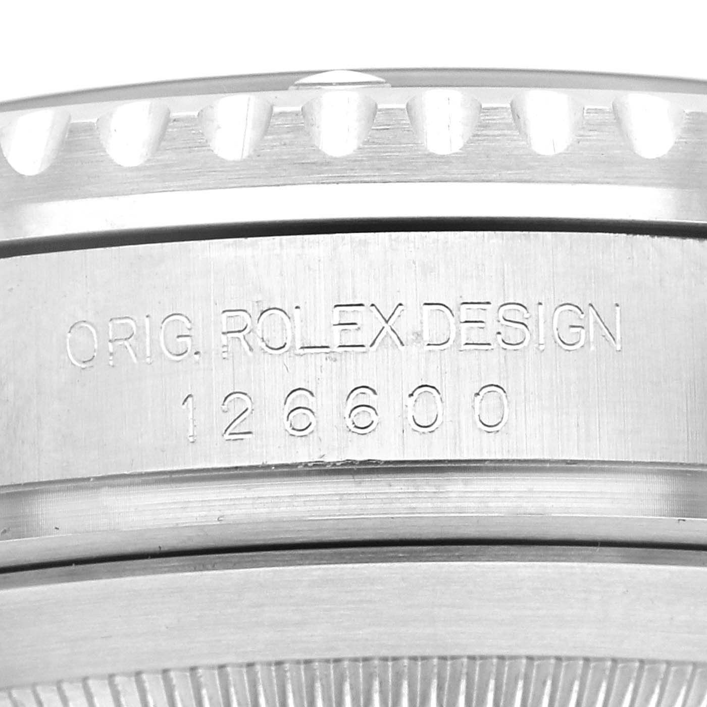 The image shows a close-up of the bezel and case side of the Rolex Sea-Dweller 126600 Men
s Stainless Steel Black Dial 126600 Men
s Stainless Steel Black Dial, featuring engravings including "ORIG. ROLEX DESIGN 126600."