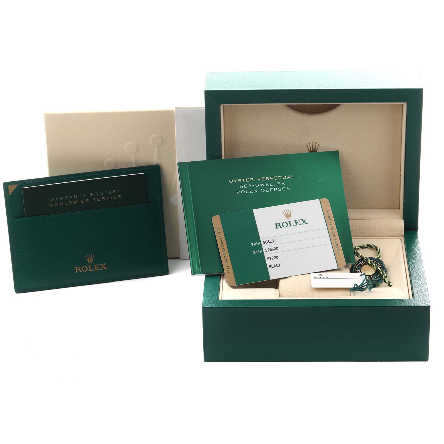 The image shows the Rolex Sea-Dweller 126600 Men
s Stainless Steel Black Dial 126600 Men
s Stainless Steel Black Dial packaging, including the box, warranty booklet, card, and tags, all viewed from above.