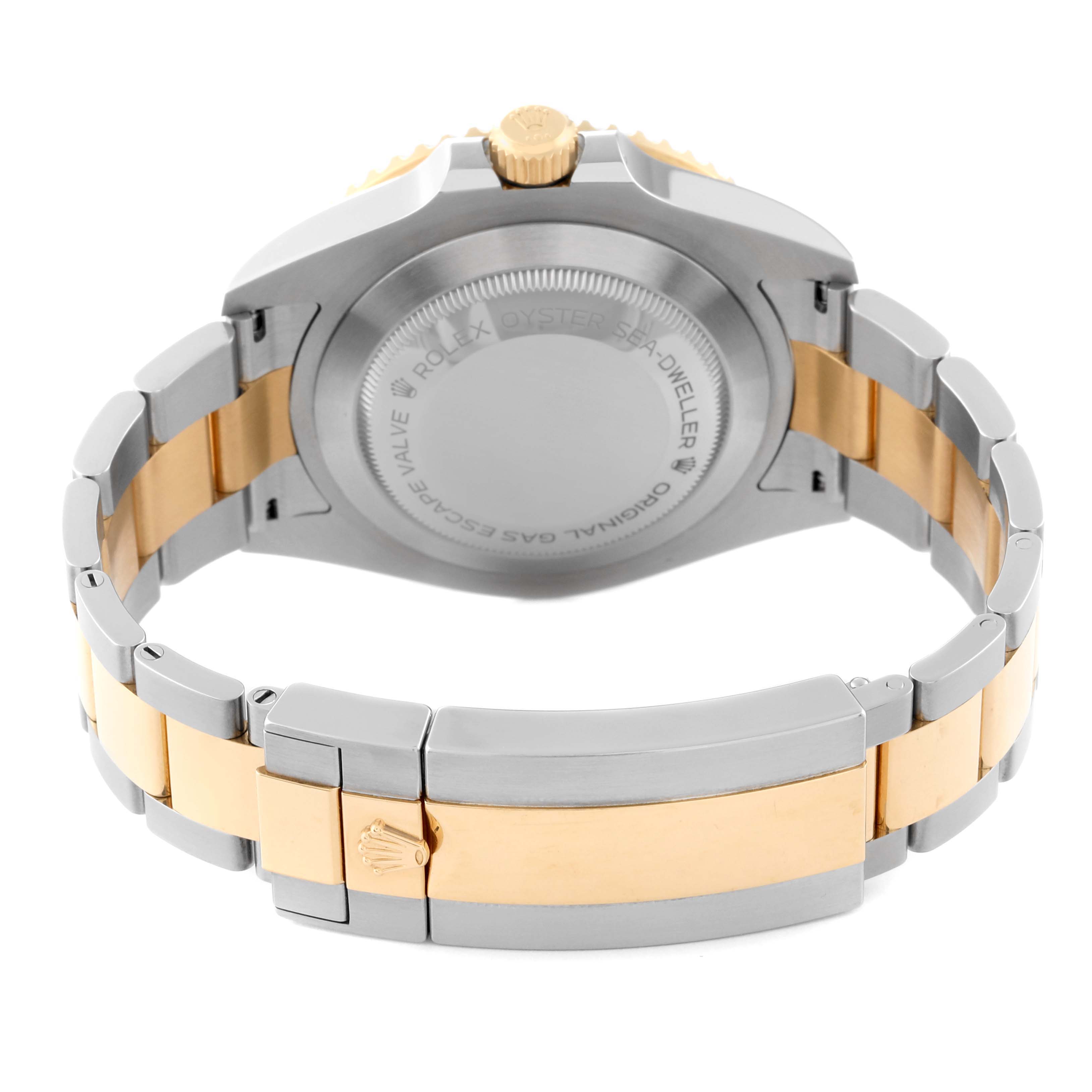 The image shows the back of a Rolex Sea-Dweller 126603 Men's Steel and Gold (two tone) Black Dial 126603 Men's Steel and Gold (two tone) Black Dial watch, highlighting the case back, crown, and two-tone bracelet.
