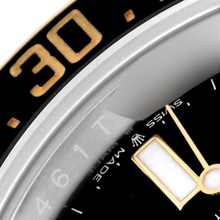 The image shows a close-up of the bezel, dial, and part of the hands of a Rolex Sea-Dweller 126603 Men's Steel and Gold (two tone) Black Dial 126603 Men's Steel and Gold (two tone) Black Dial watch.