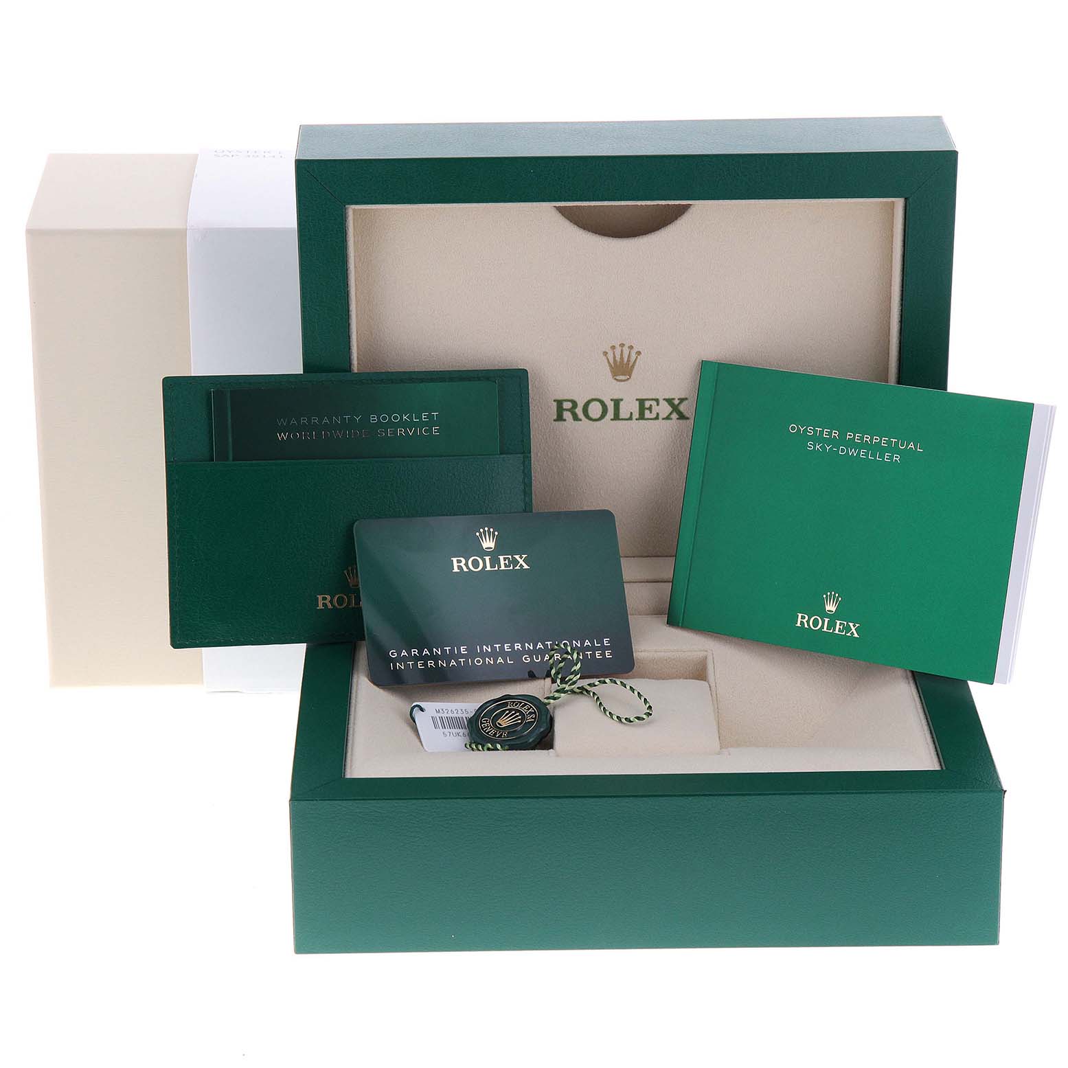The image shows the packaging and accessories of a Rolex Sky-Dweller 326235 Men's Rose Gold Grey Dial 326235 Men's Rose Gold Grey Dial, including the box, warranty booklet, and international guarantee card.
