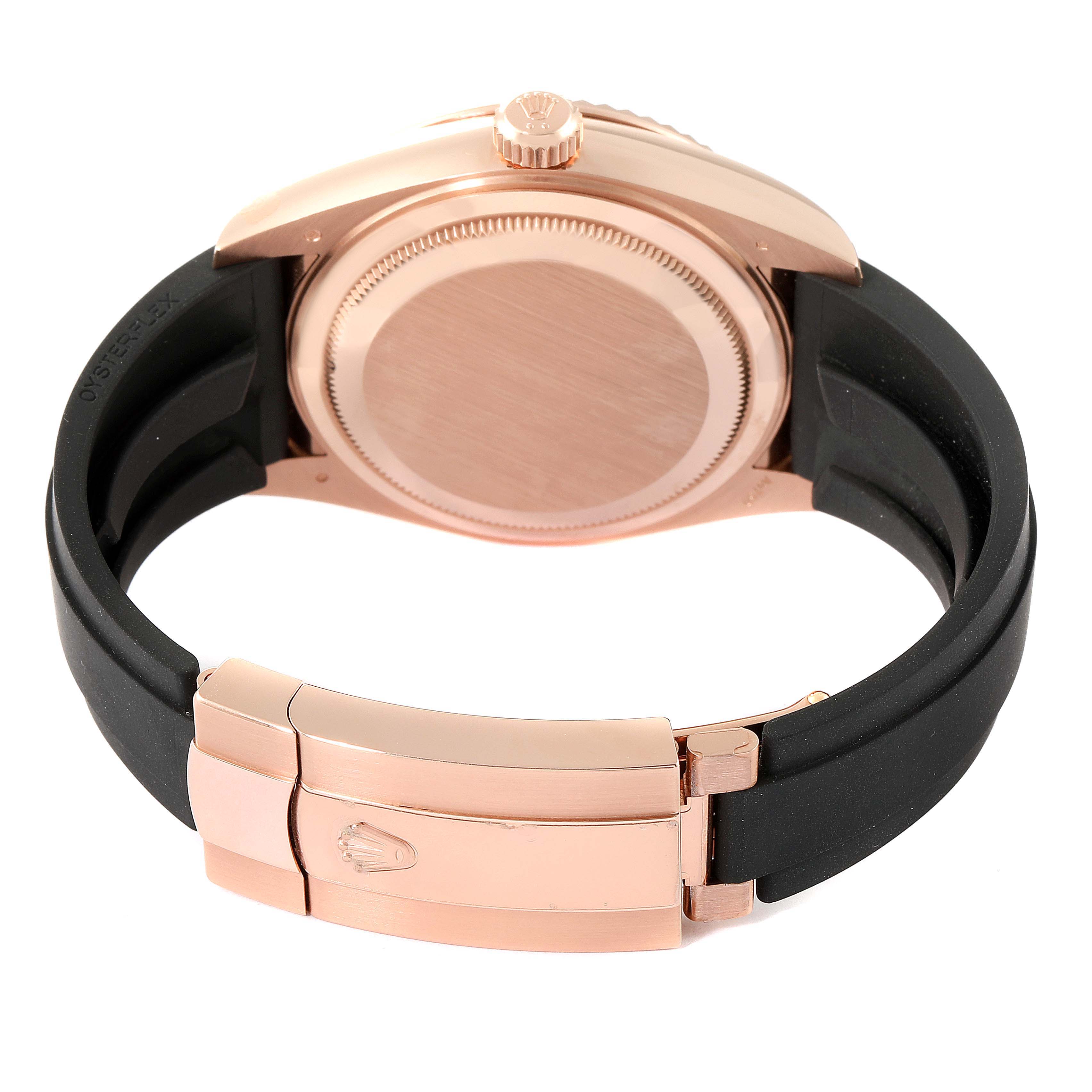 The image shows the back case, crown, and clasp of a Rolex Sky-Dweller 326235 Men's Rose Gold Grey Dial 326235 Men's Rose Gold Grey Dial watch, focusing on its rose gold and black rubber strap.