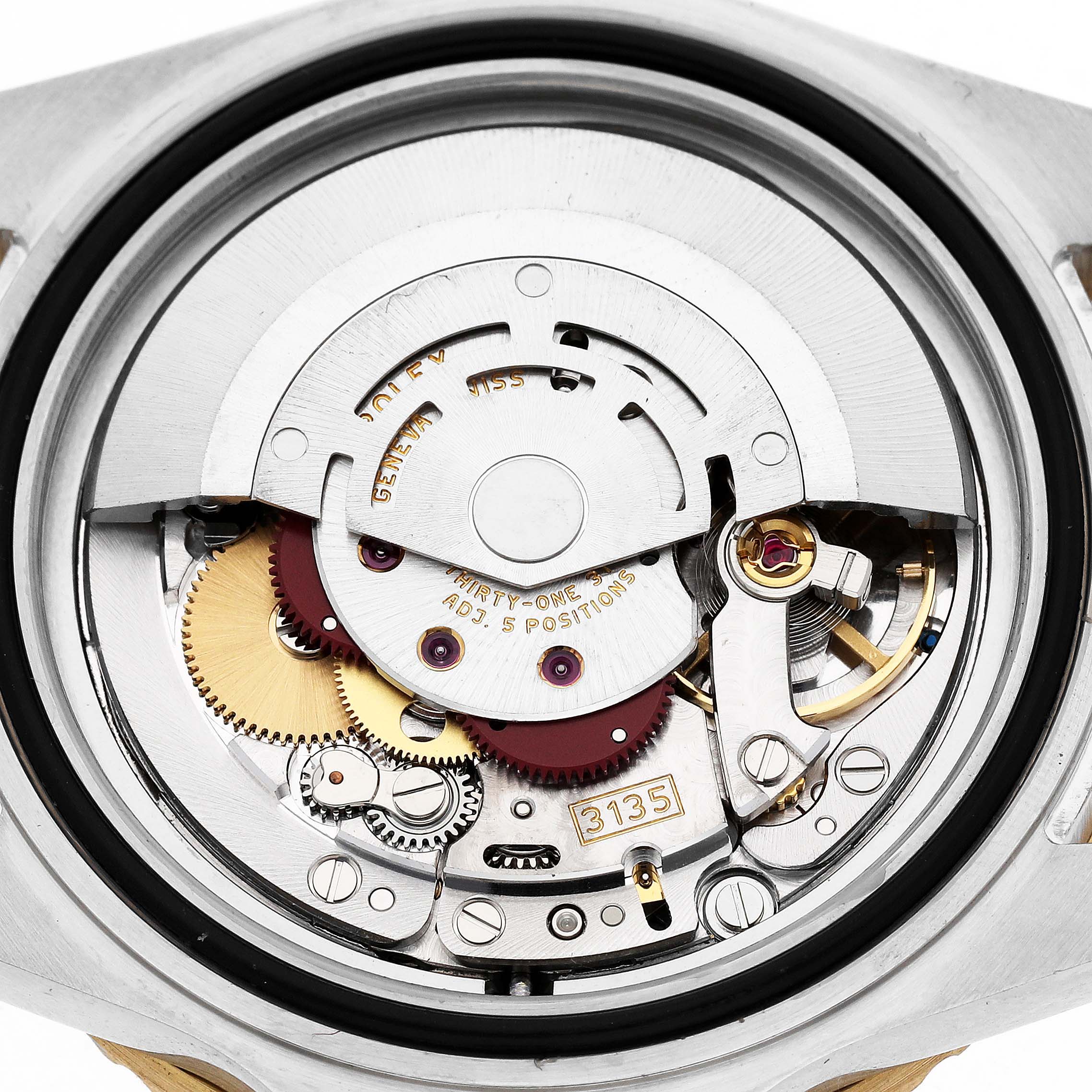 The image shows the movement of a Rolex Submariner 16613 Men's Steel and Gold (two tone) Champagne Dial watch, displaying its intricate internal mechanism from the back.