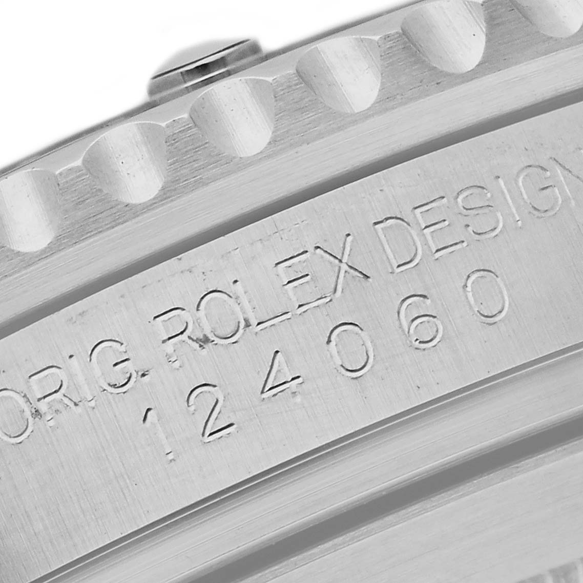 The image shows a close-up of the engraved model number on the side of the bezel of a Rolex Submariner 124060 Men's Stainless Steel Black Dial 124060 Men's Stainless Steel Black Dial watch.