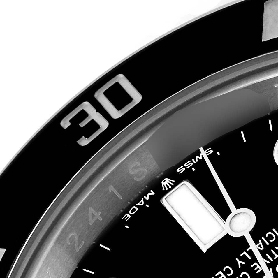 This close-up image shows the bezel, part of the dial, and some markers of a Rolex Submariner 124060 Men's Stainless Steel Black Dial 124060 Men's Stainless Steel Black Dial watch.