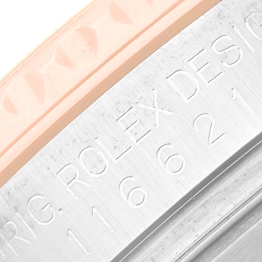 This close-up image shows part of the bezel and engraved case side of the Rolex Yacht-Master 116621 Men's Steel and Gold (two tone) Black Dial 116621 Men's Steel and Gold (two tone) Black Dial watch.