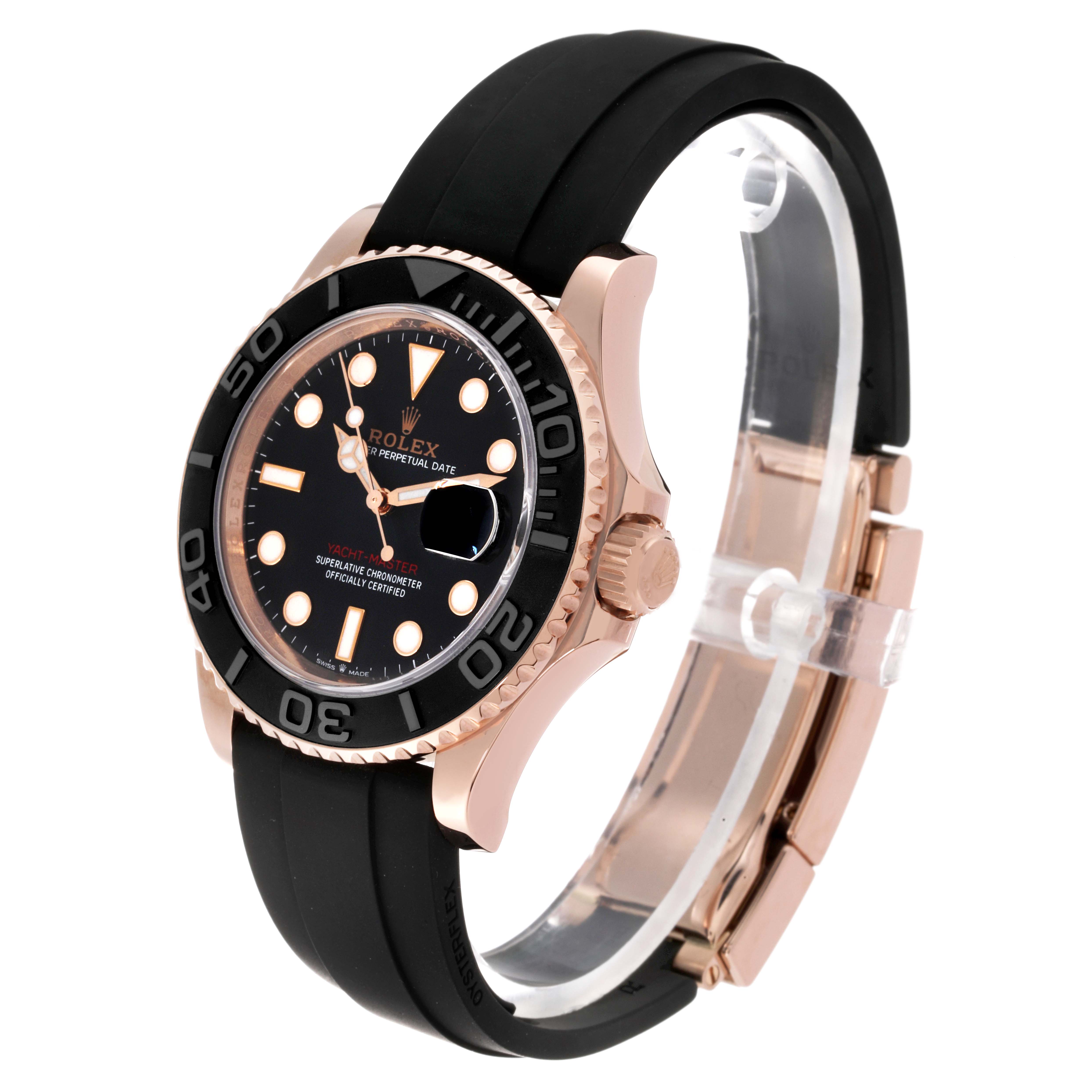 The Rolex Yacht-Master 126655 Men's Rose Gold Black Dial 126655 Men's Rose Gold Black Dial watch is shown from an angled side view, highlighting its black dial, bezel, and black rubber strap.