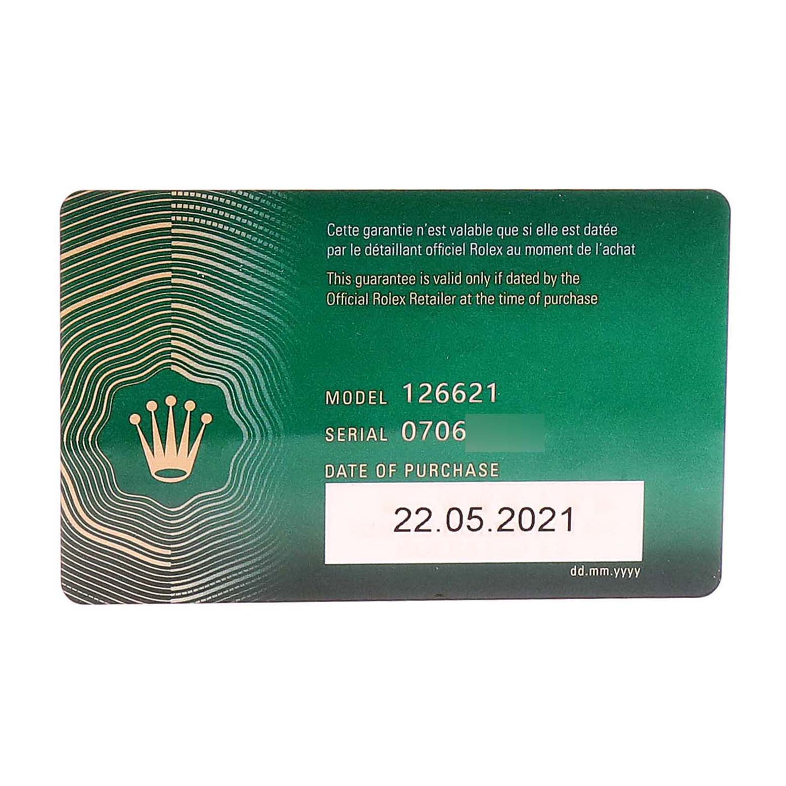 This image shows a green Rolex Yacht-Master 126621 Men's Steel and Gold (two tone) Black Dial 126621 Men's Steel and Gold (two tone) Black Dial model 126621 warranty card with the date of purchase and serial number.