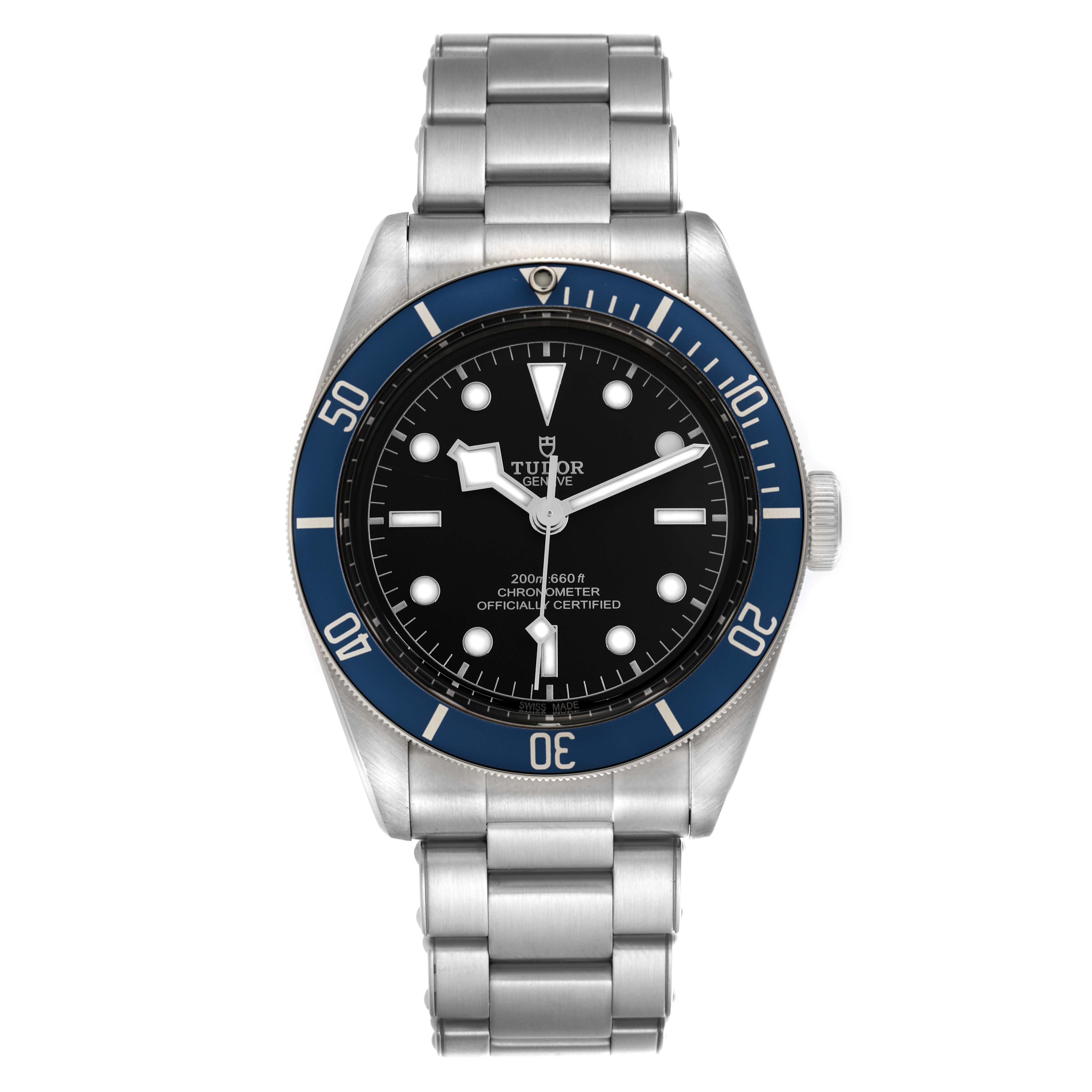 The Tudor Heritage Black Bay 79230B Men
s Stainless Steel Black Dial 79230B Men
s Stainless Steel Black Dial watch is shown from a top-down angle, displaying its dial, bezel, and bracelet.