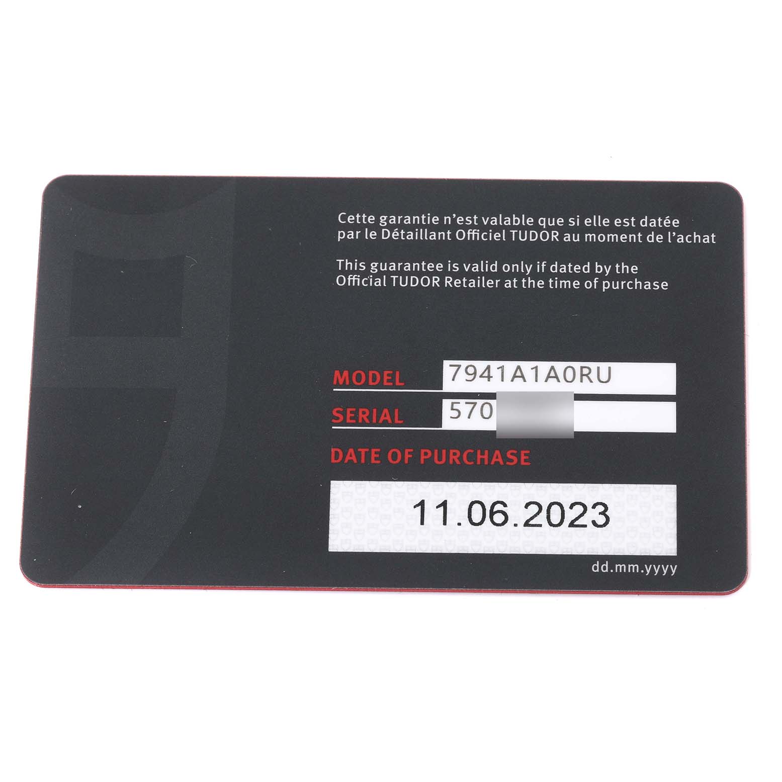 This image shows the warranty card for the Tudor Heritage Black Bay 7941A1A0RU Men
s Stainless Steel Black Dial 7941A1A0RU Men
s Stainless Steel Black Dial watch, displaying the model, serial number, and purchase date.