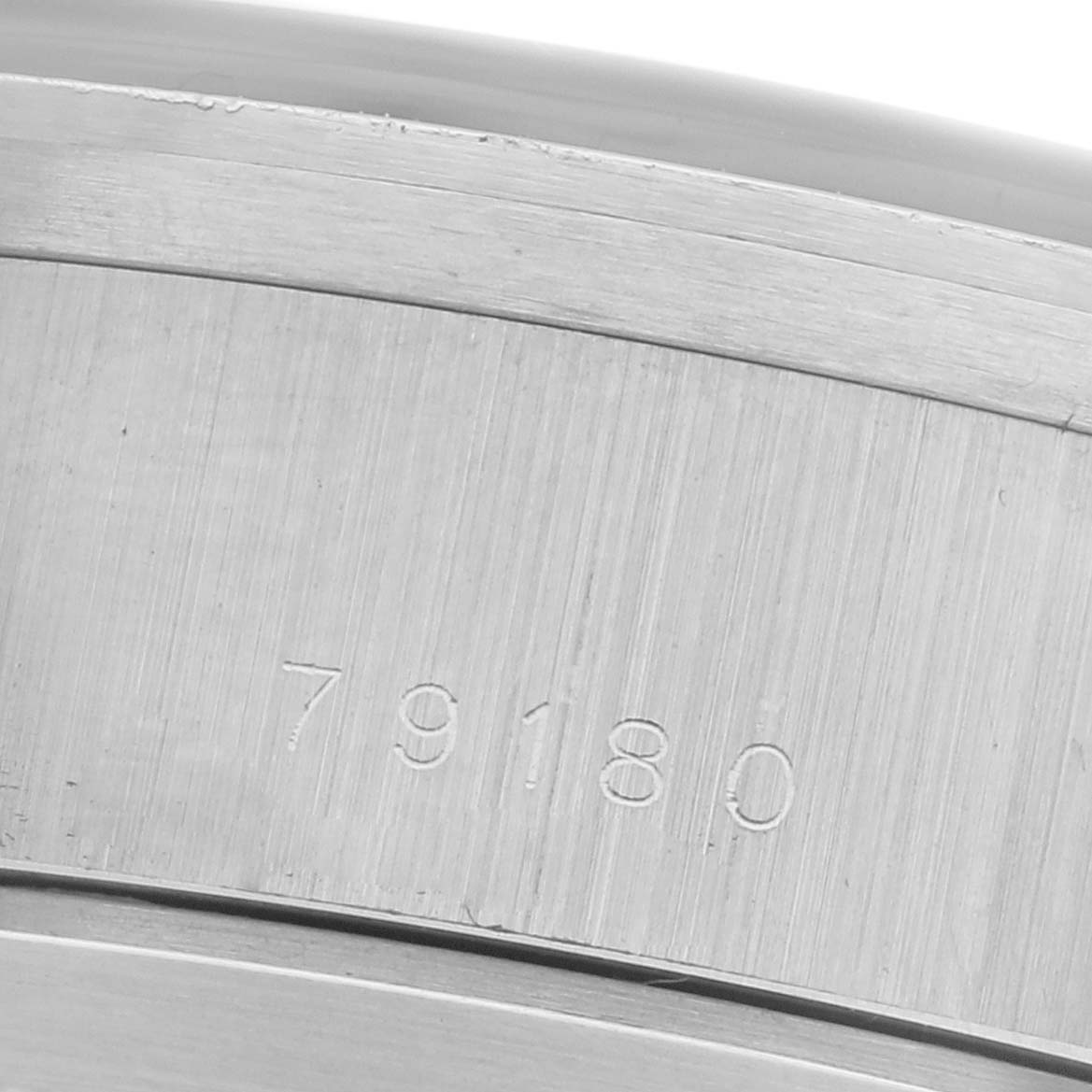 The image shows a close-up of the engraved case side of the Tudor Prince 79180 Men
s Stainless Steel Black Dial 79180 Men
s Stainless Steel Black Dial watch, revealing the model number 79180.