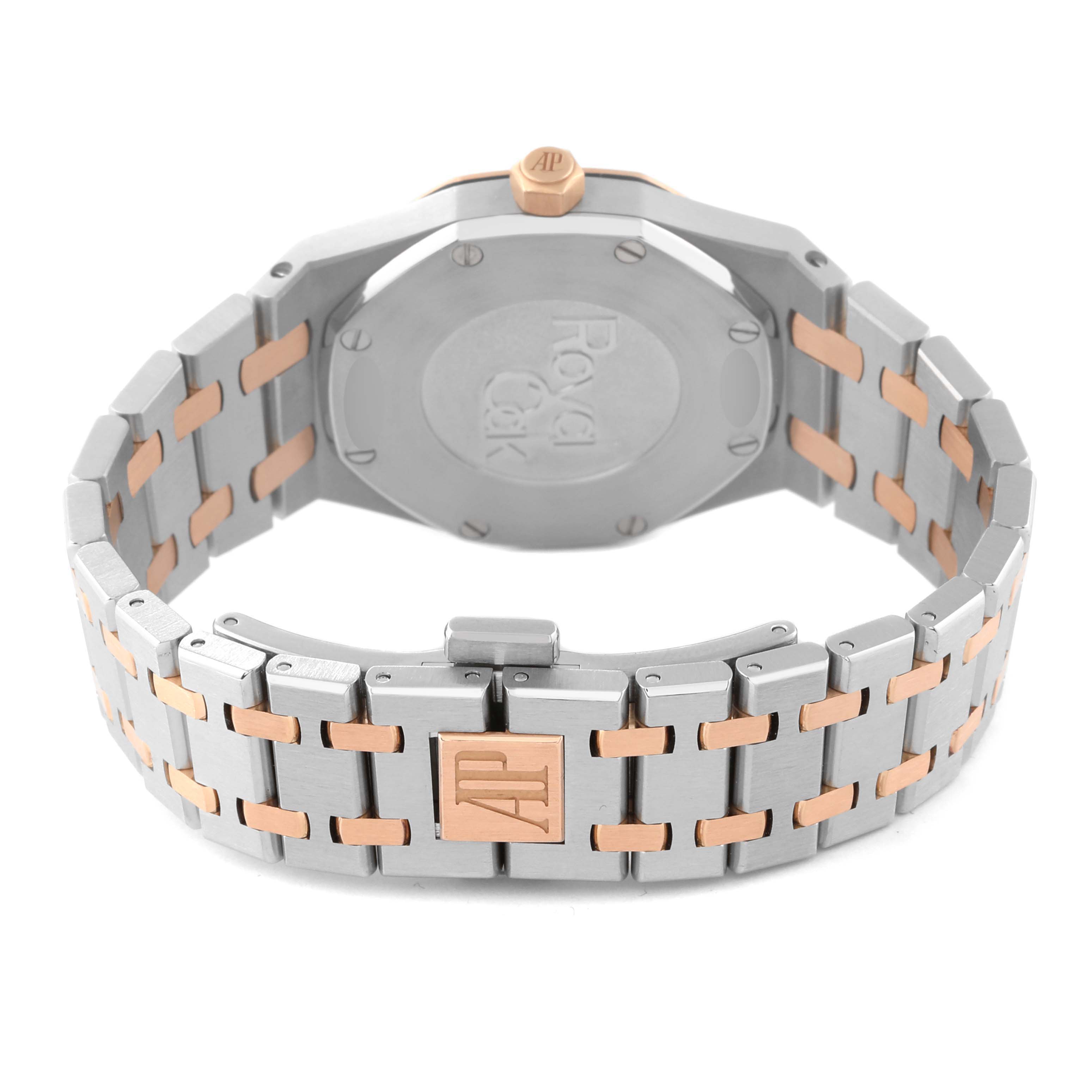 The image shows the back of a Royal Oak model by Audemars Piguet, including the case back, crown, and bracelet with AP clasp.