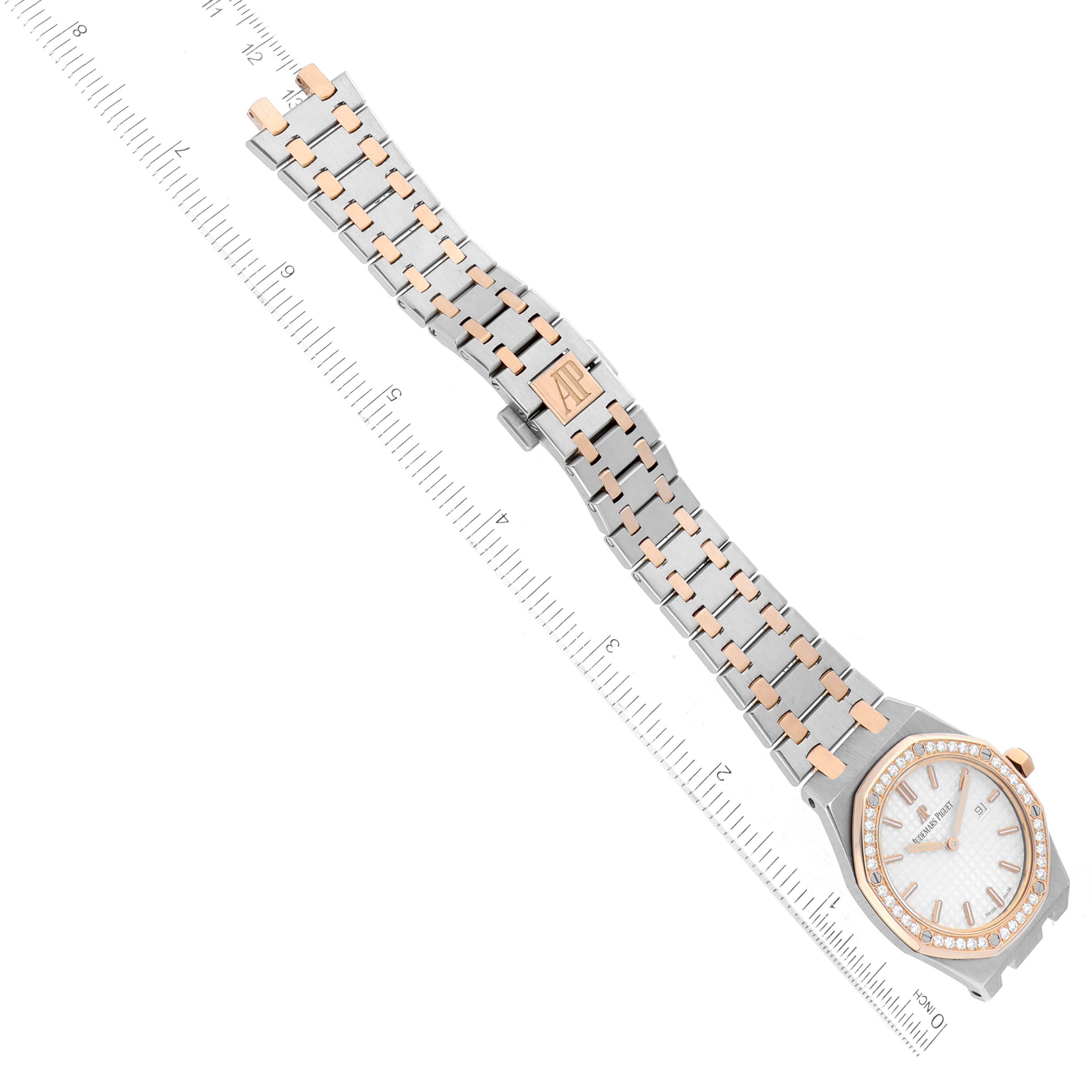 This image shows the Audemars Piguet Royal Oak 67651SR.ZZ.1261SR.01 Women
s Steel and Gold (two tone) Silver Dial 67651SR.ZZ.1261SR.01 Women
s Steel and Gold (two tone) Silver Dial watch laid flat, viewed from a top angle, highlighting the face, band, and clasp.