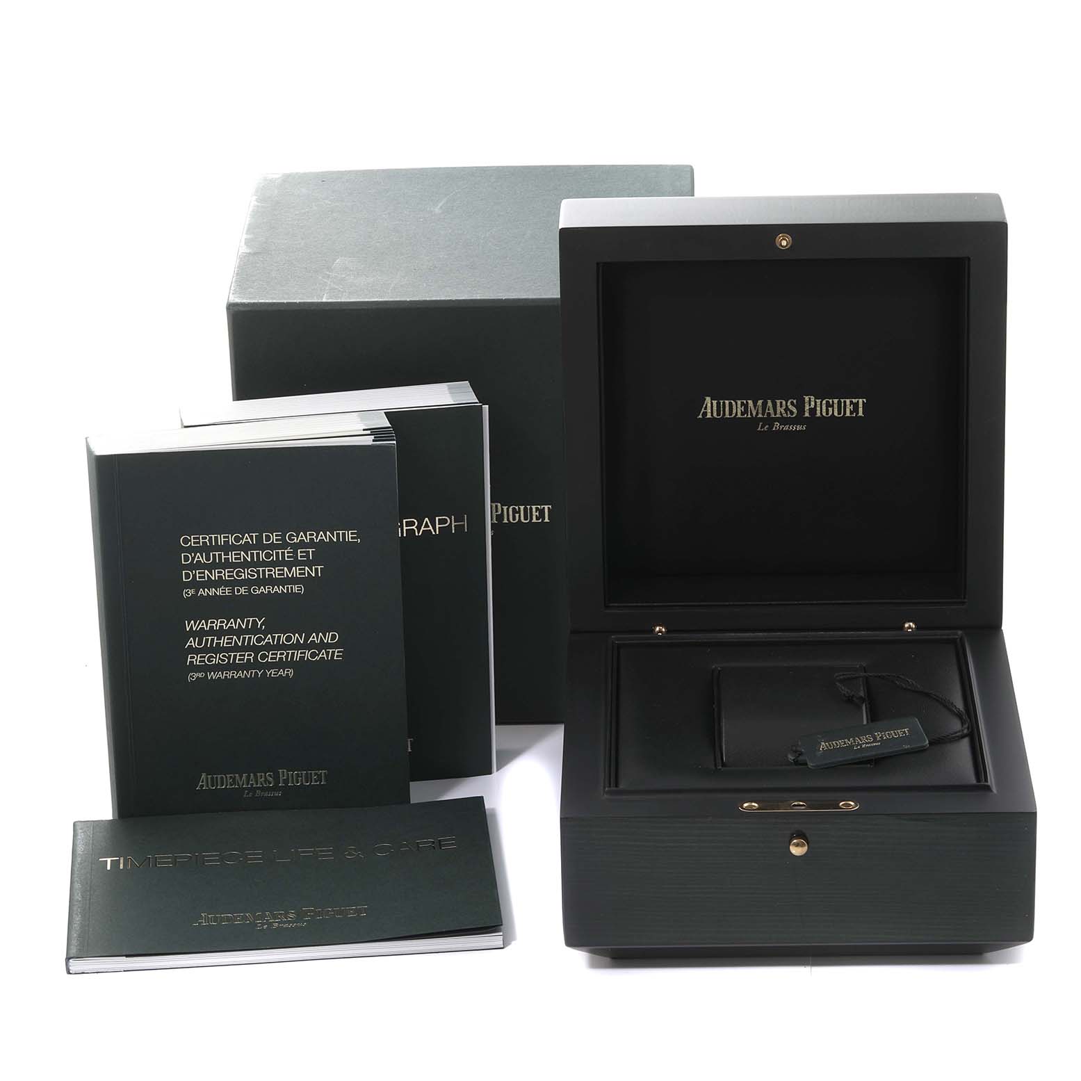 This image shows the box and documentation for the Audemars Piguet Royal Oak Offshore 26470ST.OO.A801CR.01 Men's Stainless Steel Silver Dial 26470ST.OO.A801CR.01 Men's Stainless Steel Silver Dial model, including the warranty card and booklets.