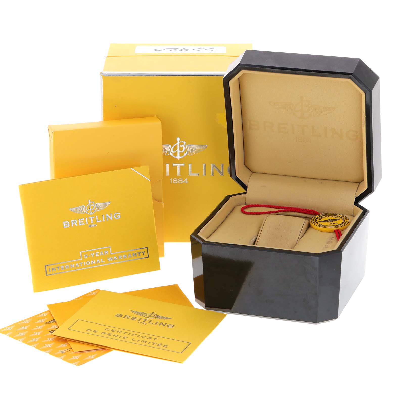 The image shows the packaging and accessories of a Breitling Navitimer AB0123 Men's Stainless Steel Silver Dial AB0123 Men's Stainless Steel Silver Dial, including the watch box, warranty cards, and certificates.