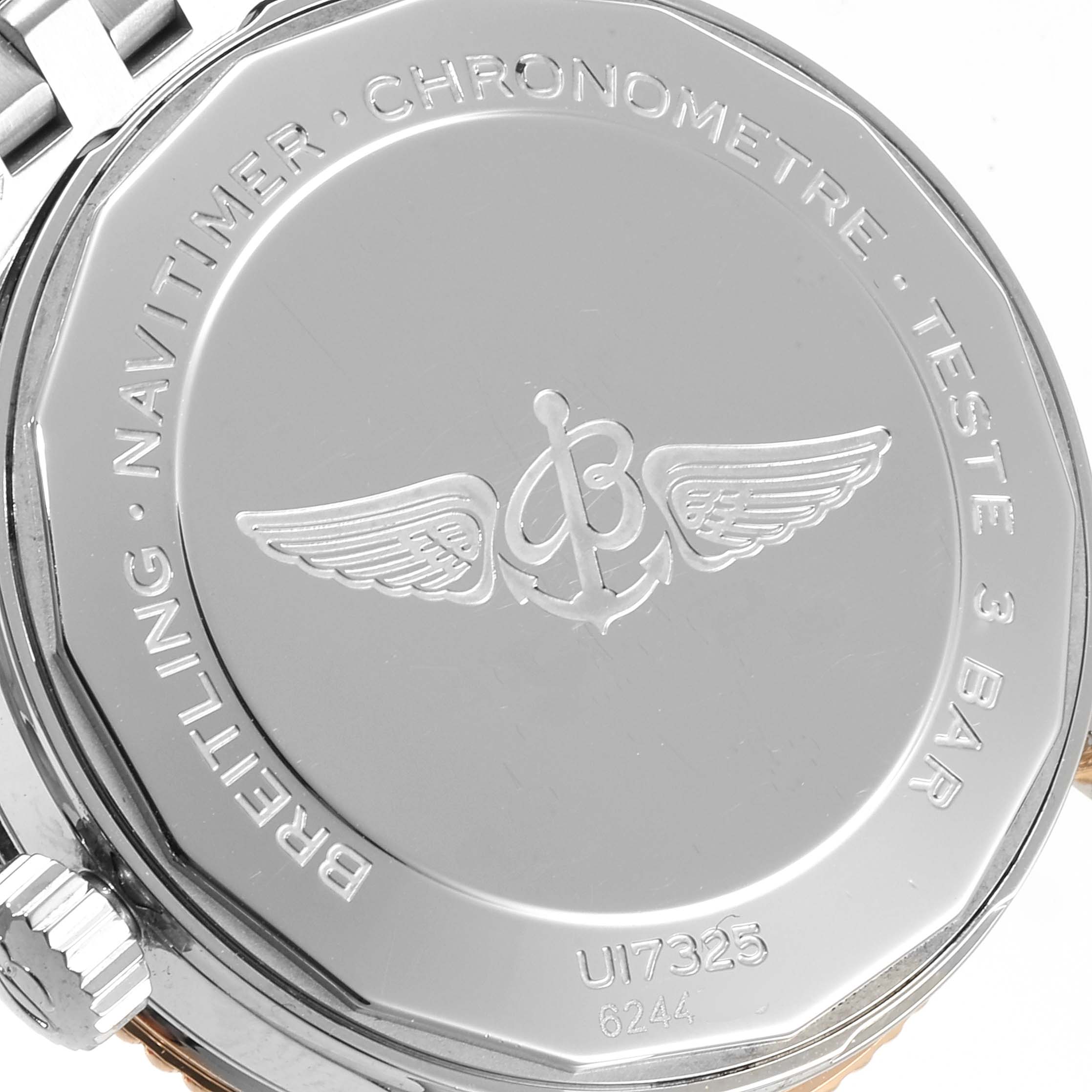 This image shows the back case of a Breitling Navitimer U17325211G1A1 Men
s Stainless Steel Silver Dial U17325211G1A1 Men
s Stainless Steel Silver Dial watch, highlighting the engraved branding and specifications.