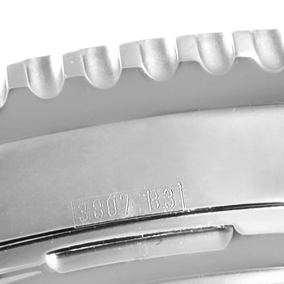 This close-up image shows the bezel and a part of the case back of a Breitling Navitimer A23322 Men
s Stainless Steel Black Dial A23322 Men
s Stainless Steel Black Dial watch.