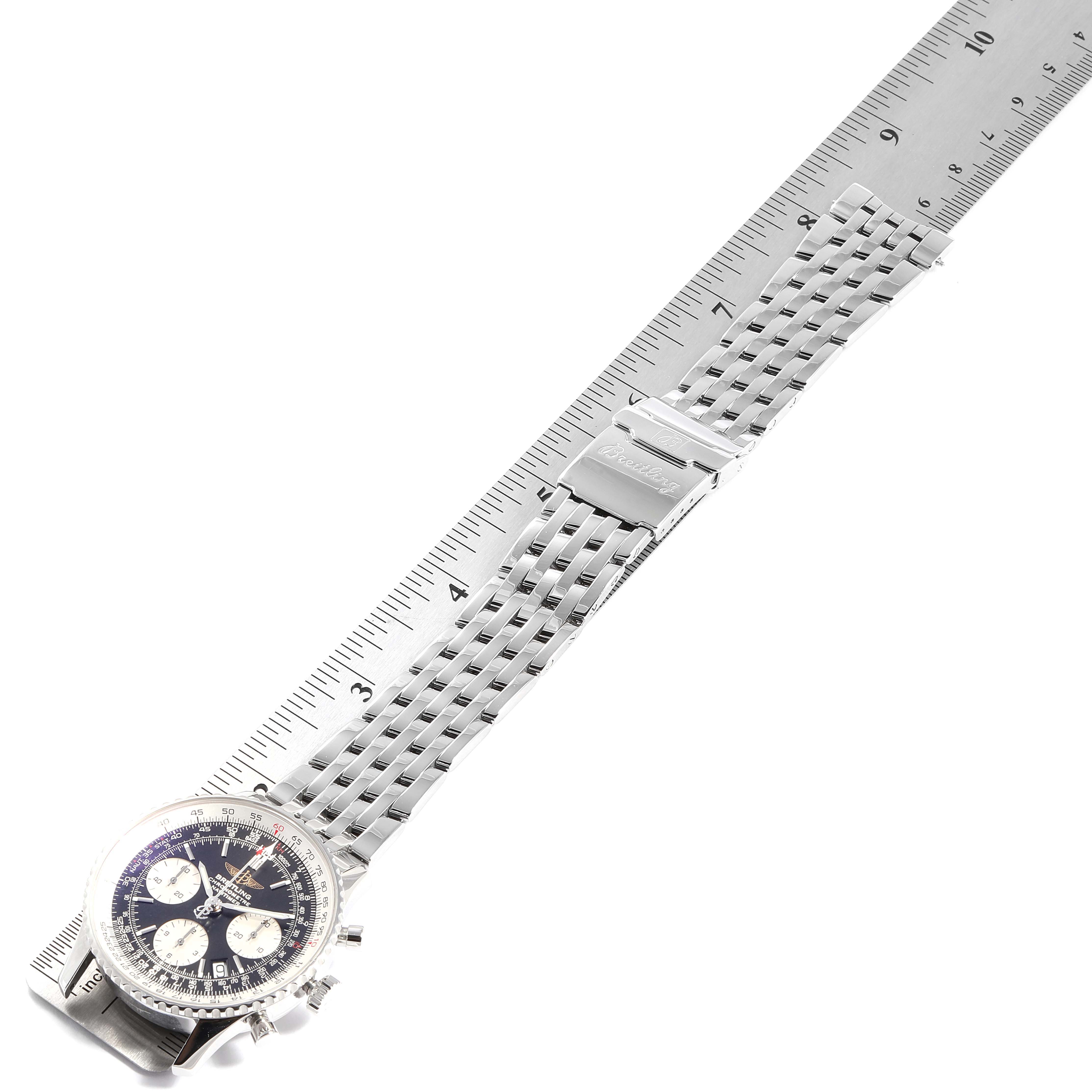 The image shows a Breitling Navitimer A23322 Men
s Stainless Steel Black Dial A23322 Men
s Stainless Steel Black Dial watch laid flat with a ruler measuring its length.