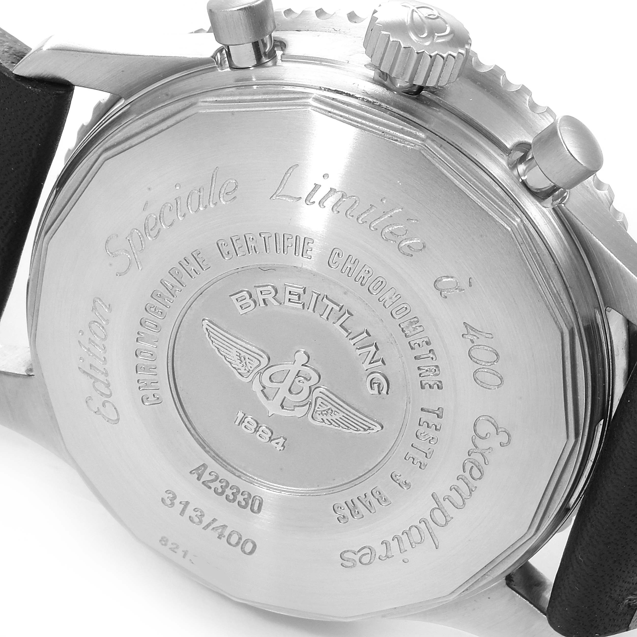 The image shows the back case and side control buttons of a Breitling Navitimer A23330 Men's Stainless Steel Silver Dial A23330 Men's Stainless Steel Silver Dial watch, highlighting the engraved details.