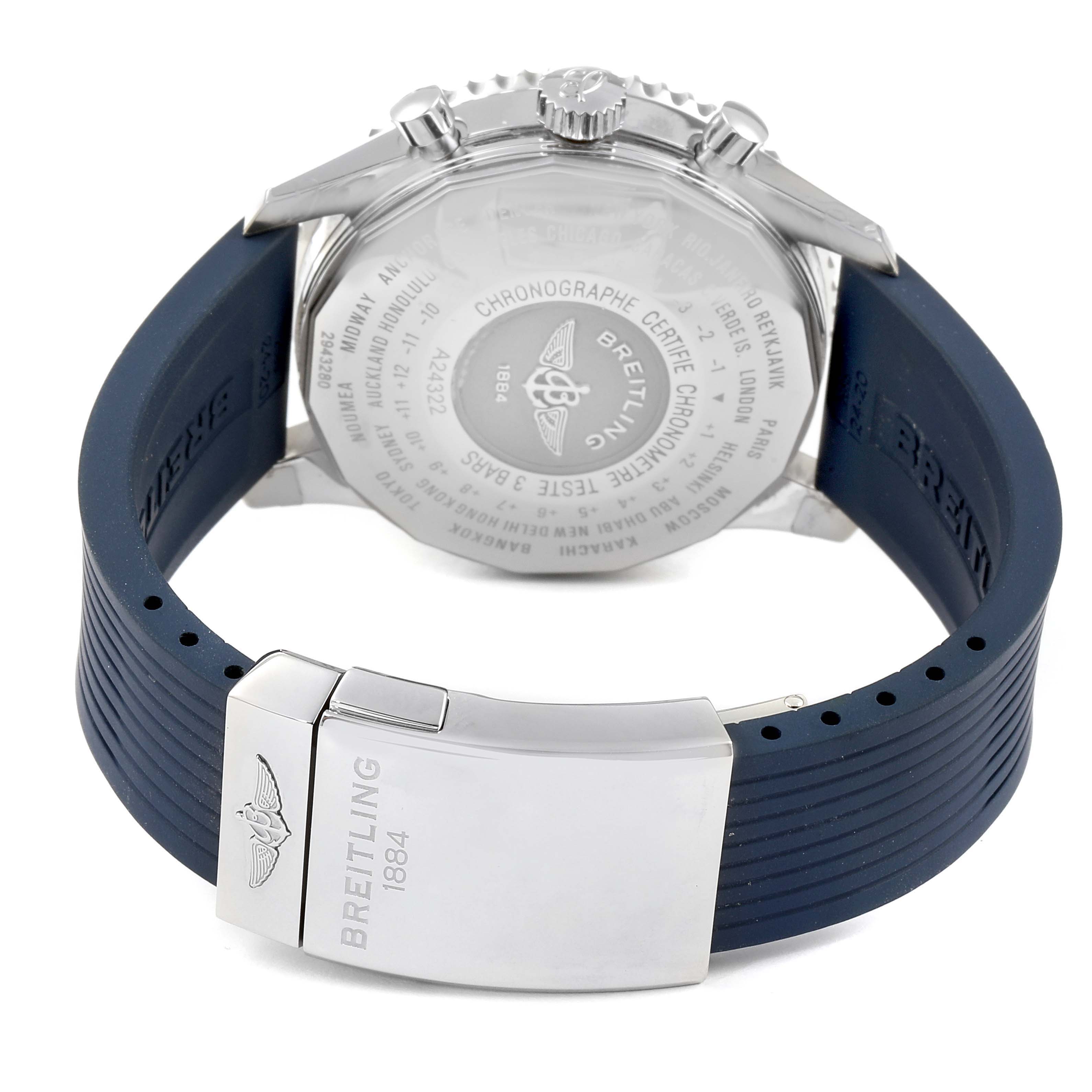 This image shows the back of a Navitimer model by Breitling along with its blue strap and stainless steel clasp.