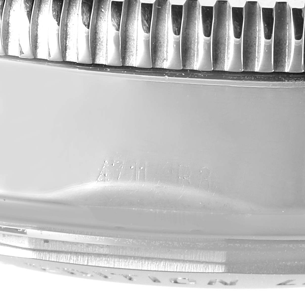 This close-up image shows the textured bezel and part of the casing of a Breitling Superocean A23320 Men's Stainless Steel Black Dial A23320 Men's Stainless Steel Black Dial watch.