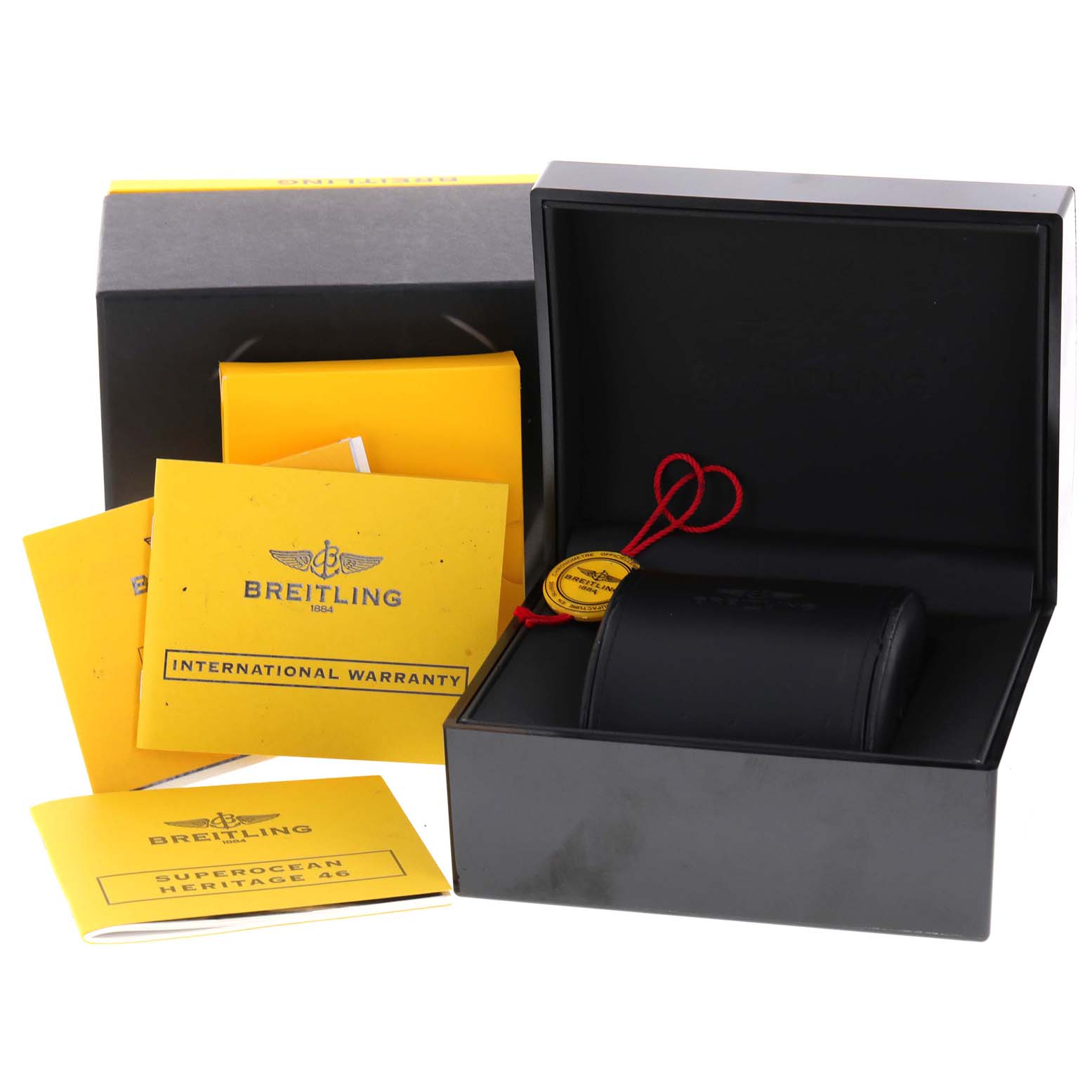 The image shows a Breitling Superocean A17320 Men
s Stainless Steel Blue Dial A17320 Men
s Stainless Steel Blue Dial watch box, warranty cards, manuals, and a black watch case from a front angle.