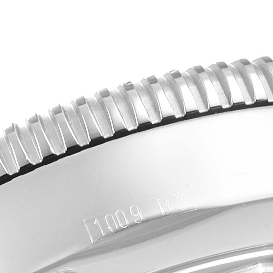 This close-up image shows the detailed, serrated edge of the bezel on a Breitling Superocean A17320 Men
s Stainless Steel Blue Dial A17320 Men
s Stainless Steel Blue Dial watch.