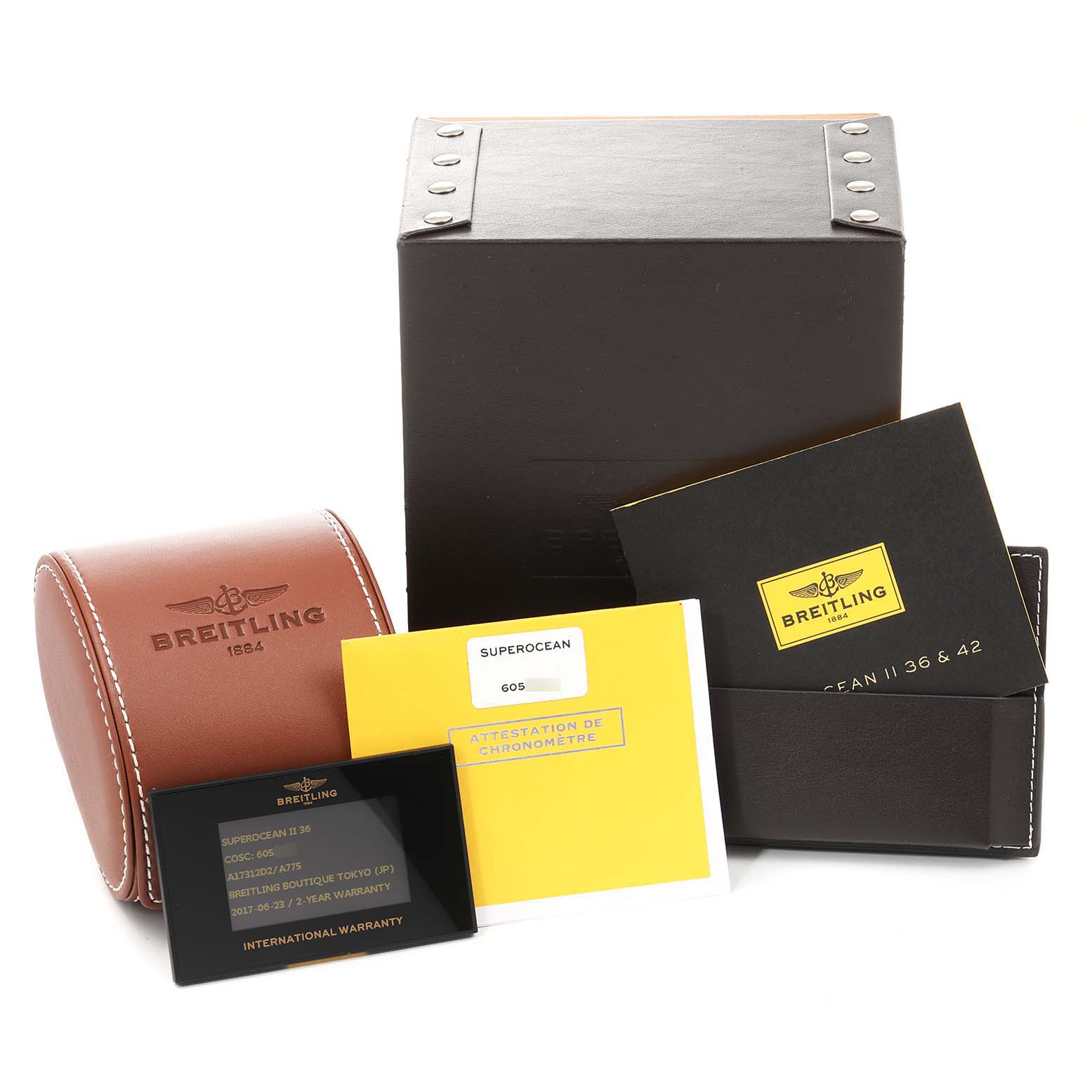 The image displays the box, warranty card, and papers for the Breitling A17312 Women's Stainless Steel White Dial A17312 Women's Stainless Steel White Dial Superocean II Hurricane 36 Ladies Watch A17312.