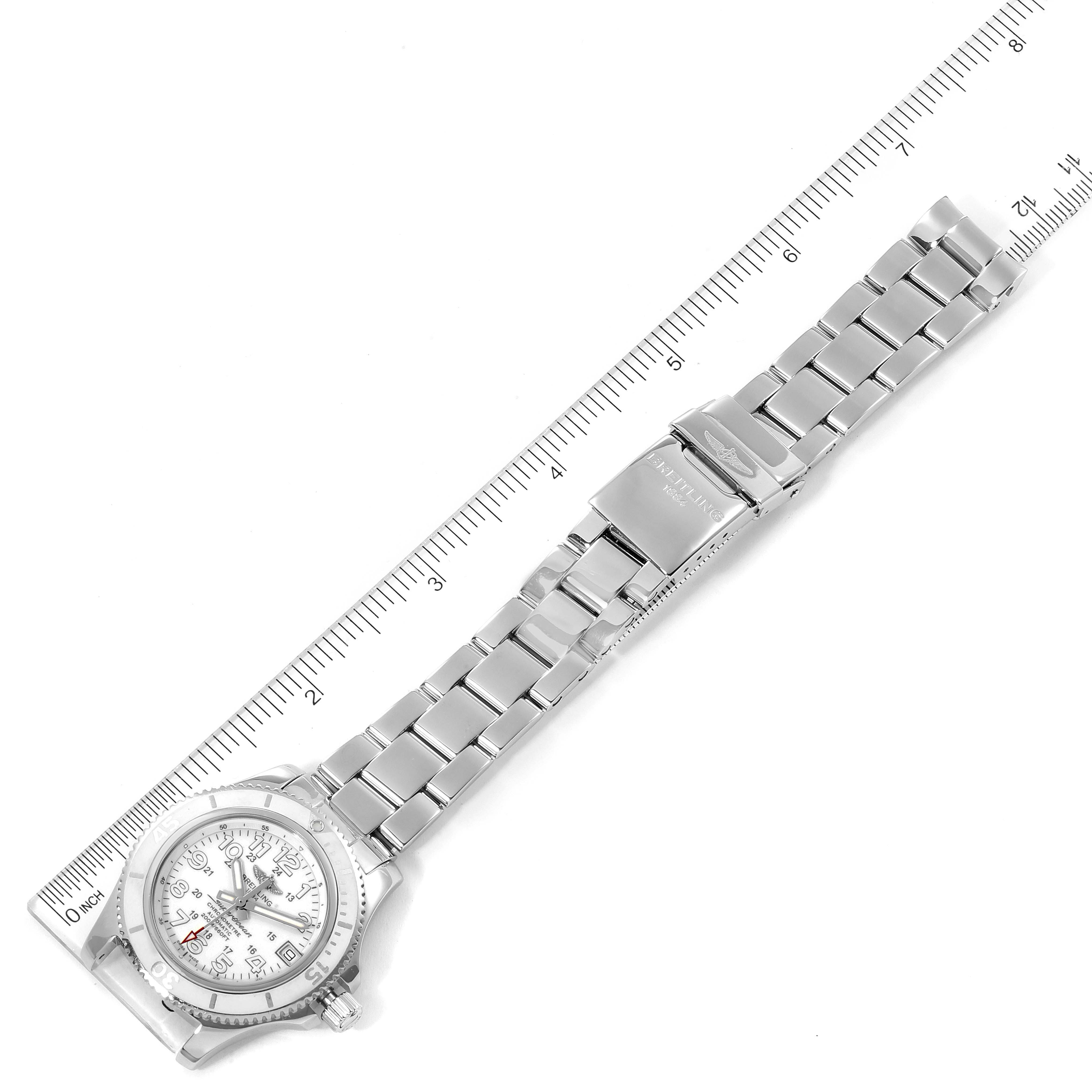 The Breitling A17312 Women's Stainless Steel White Dial A17312 Women's Stainless Steel White Dial Superocean II Hurricane 36 Ladies Watch A17312 is shown laid out flat with a ruler for measurement.