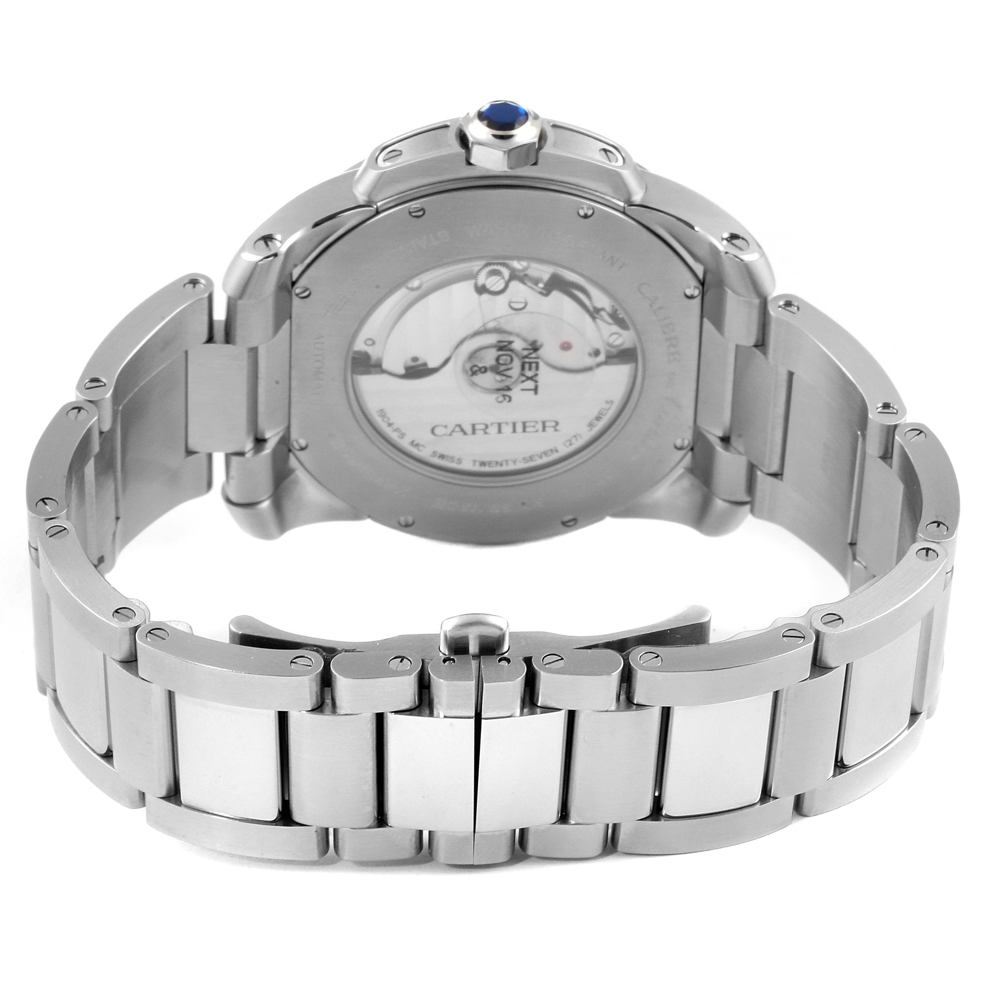 The image shows the back view of the Calibre de Cartier watch by Cartier, highlighting its movement and bracelet.