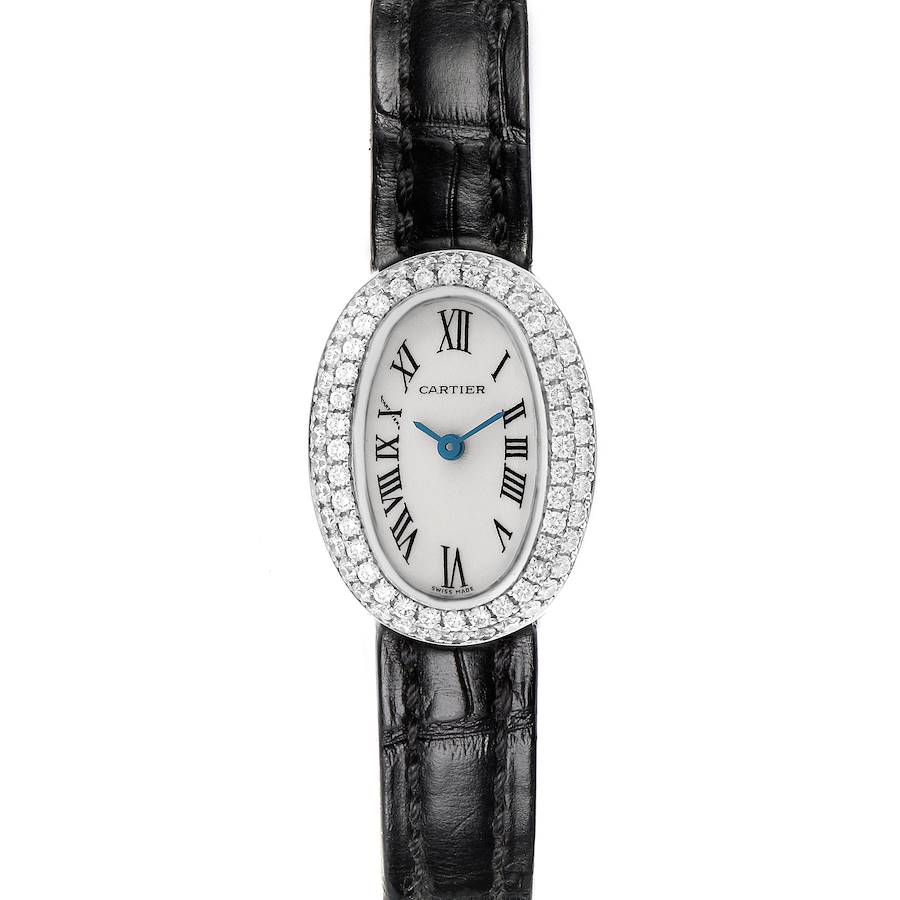 The Cartier Baignoire watch is shown from the front, displaying its oval face, diamond bezel, and black leather strap.
