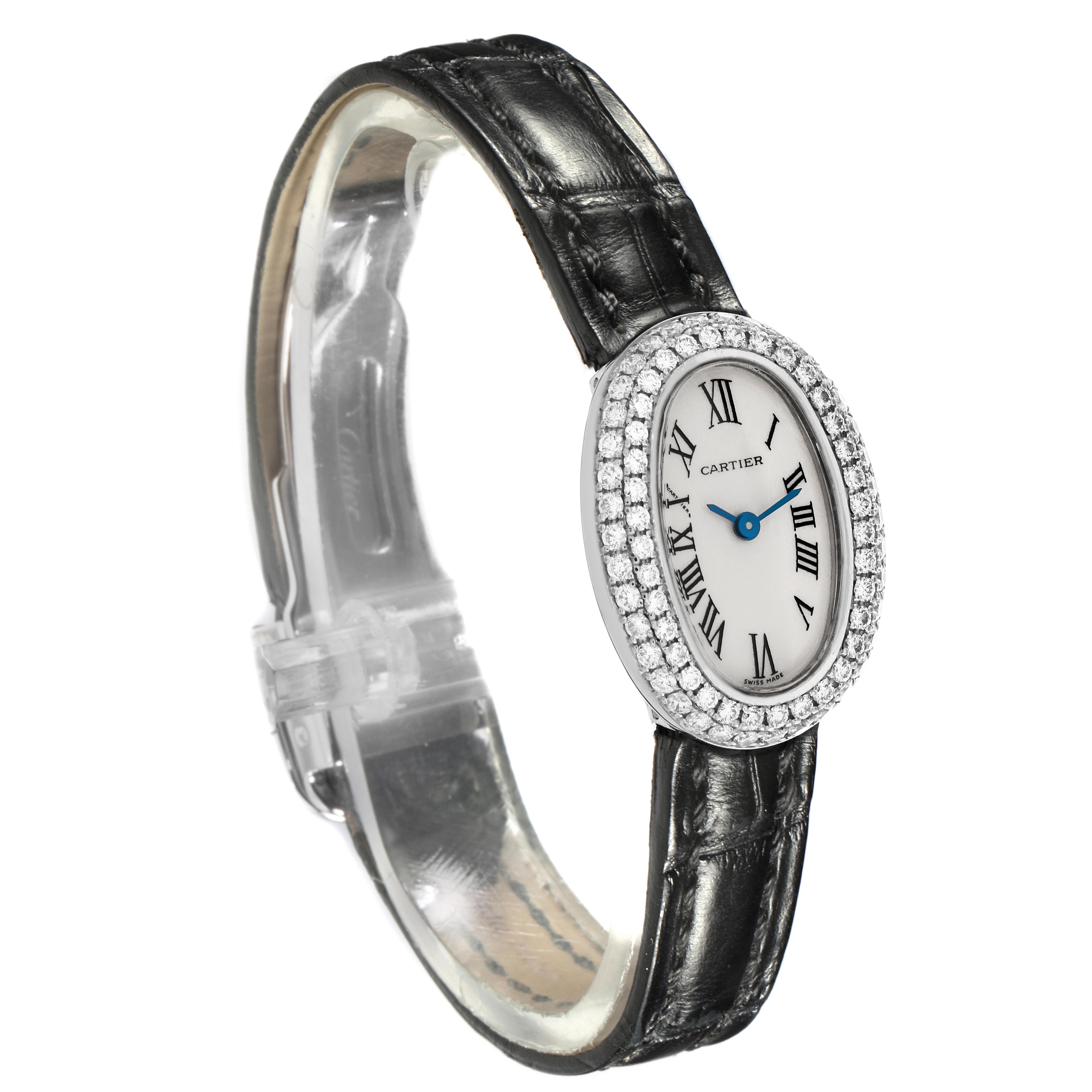 The Cartier Baignoire WB509531 Women
s White Gold White Dial WB509531 Women
s White Gold White Dial watch is shown at a slight angle, highlighting its oval face, diamond bezel, and black leather strap.