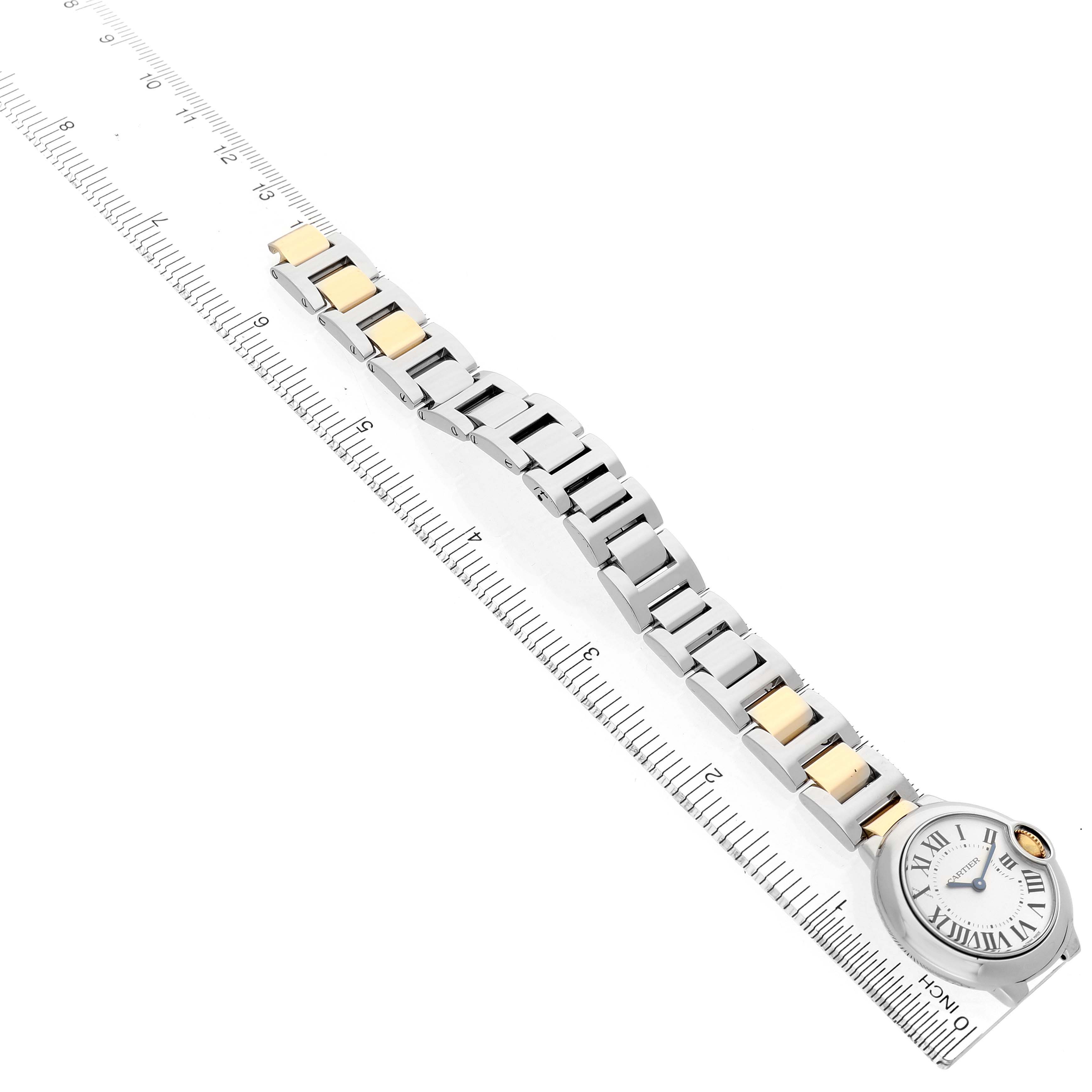 The Cartier Ballon Bleu W69007Z3 Women's Steel and Gold (two tone) Silver Dial watch is shown at an oblique angle, highlighting the bracelet and face with a ruler for scale.