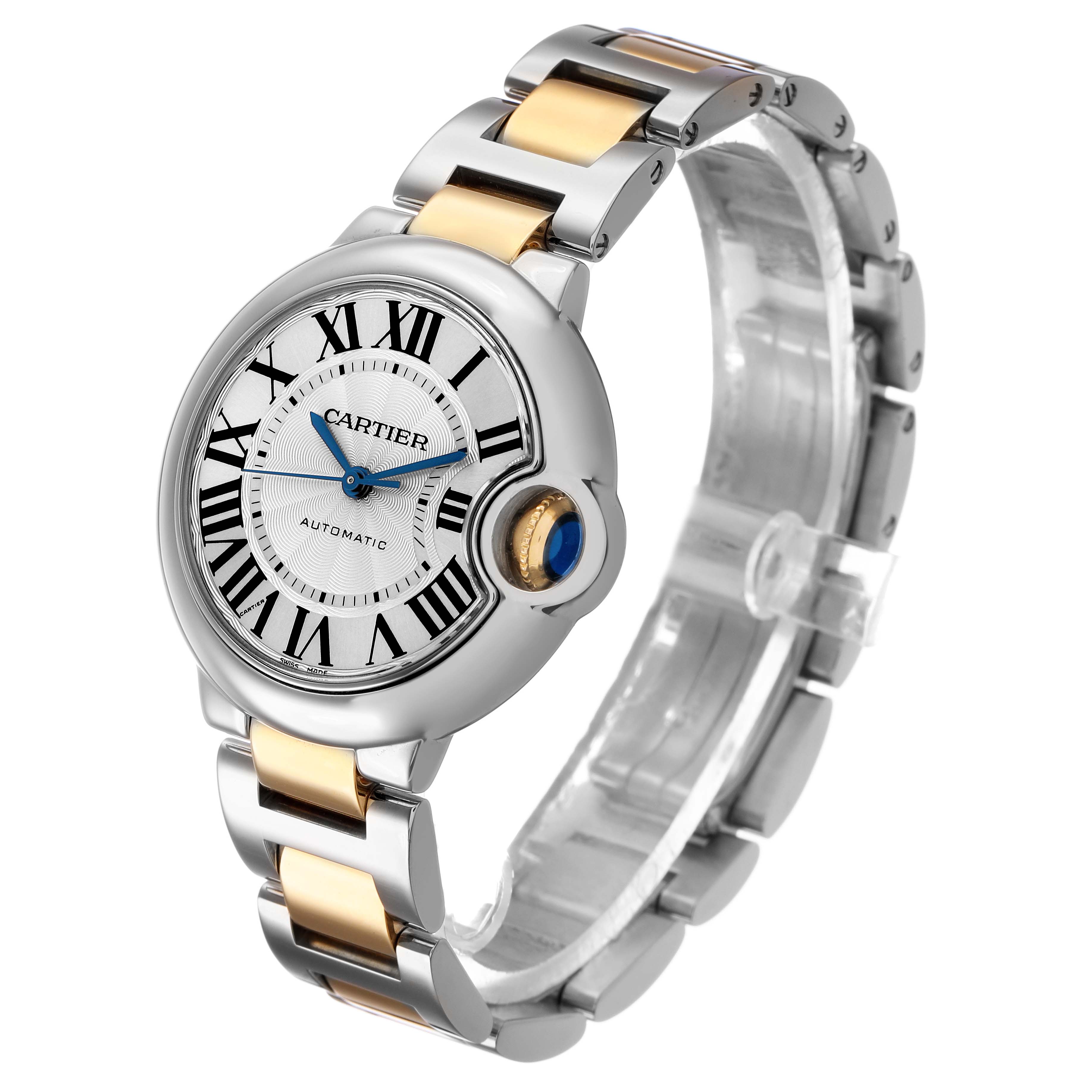 The Cartier Ballon Bleu W2BB0002 Women's Stainless Steel Silver Dial watch is shown at a three-quarter angle, highlighting its Roman numerals, blue hands, and bi-metal bracelet.