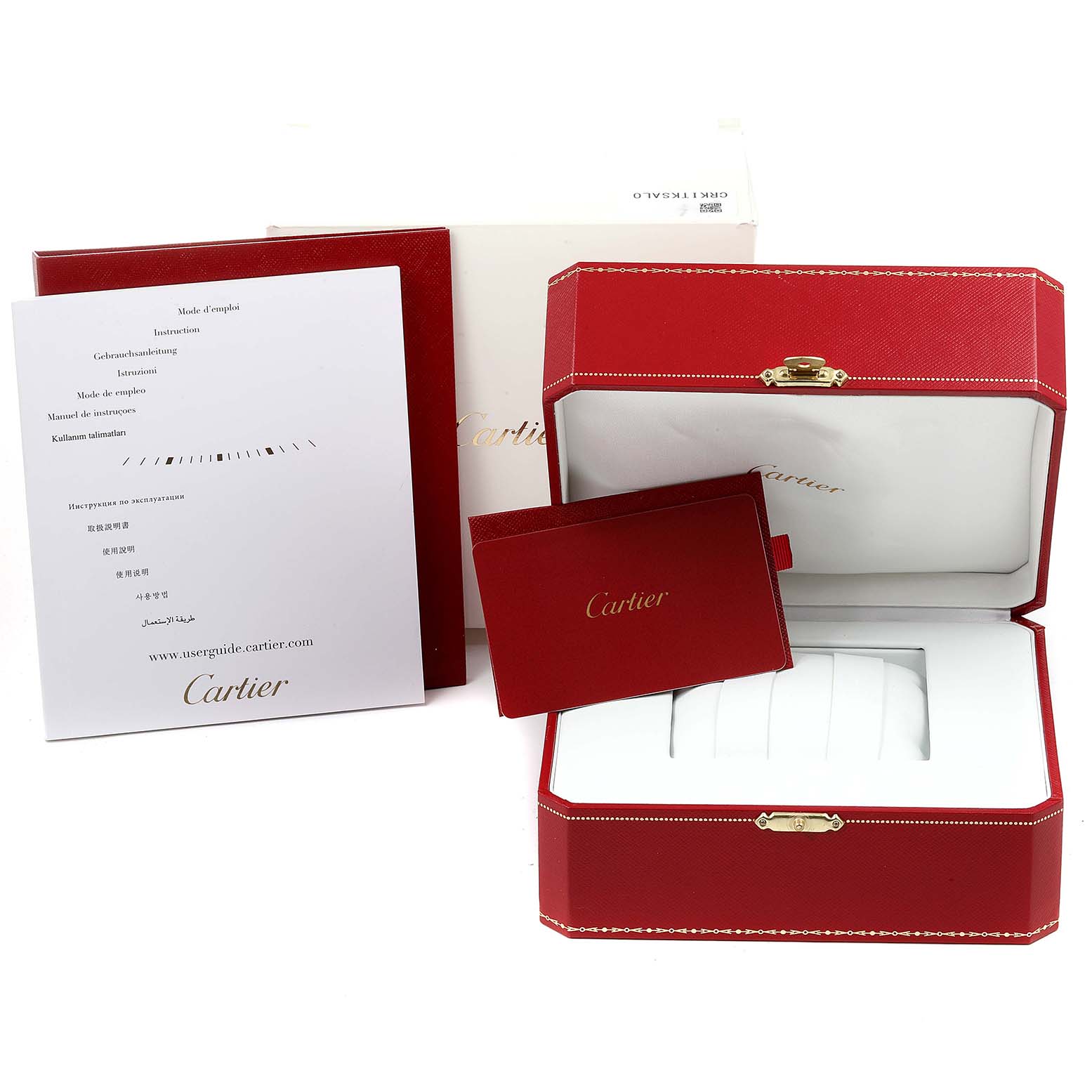 The image shows the packaging and accessories of a Calibre de Cartier watch by Cartier, including a watch box, warranty card, and instruction manual.