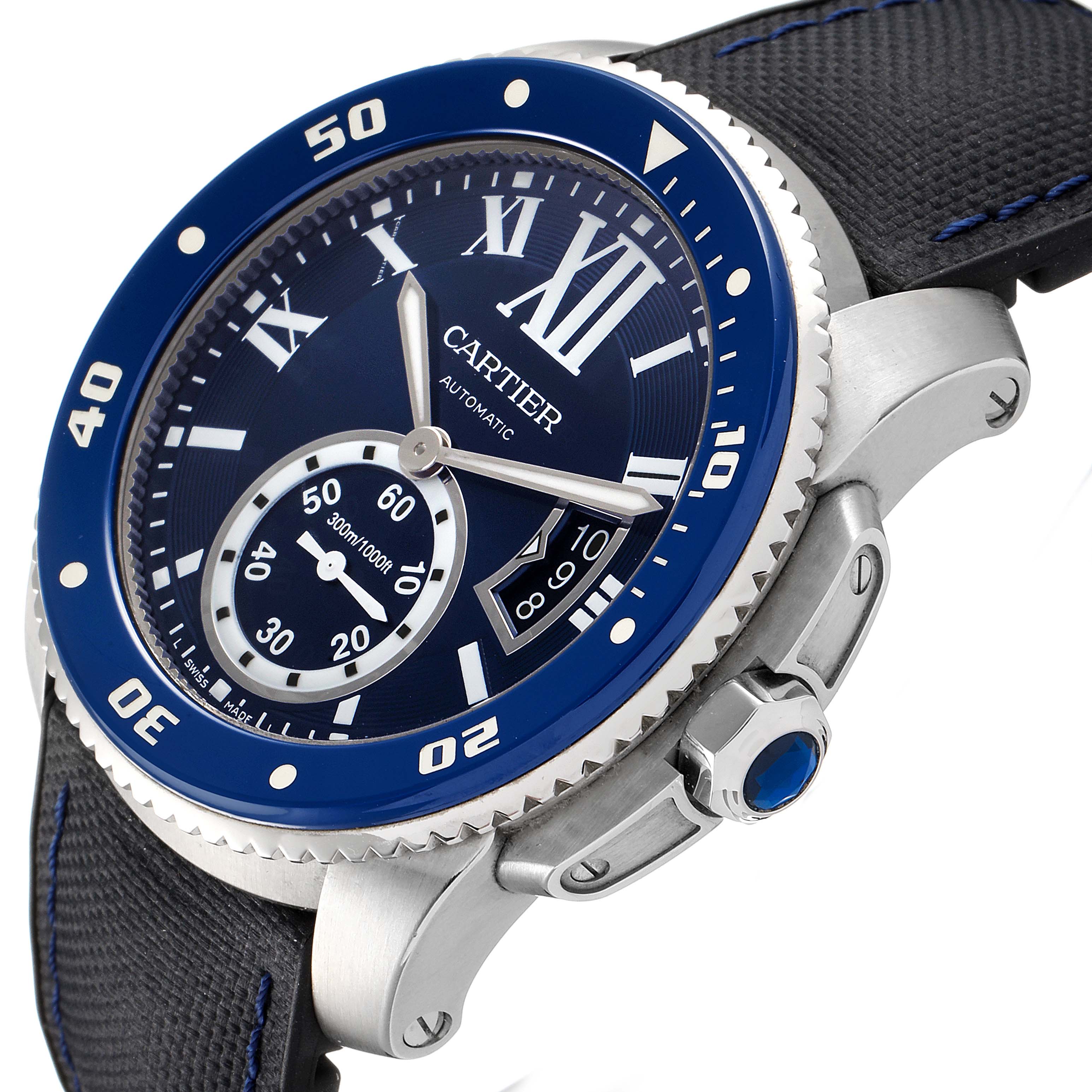 The Calibre de Cartier watch by Cartier is shown at a slight side angle, highlighting its blue bezel, dial, crown, and watch strap.