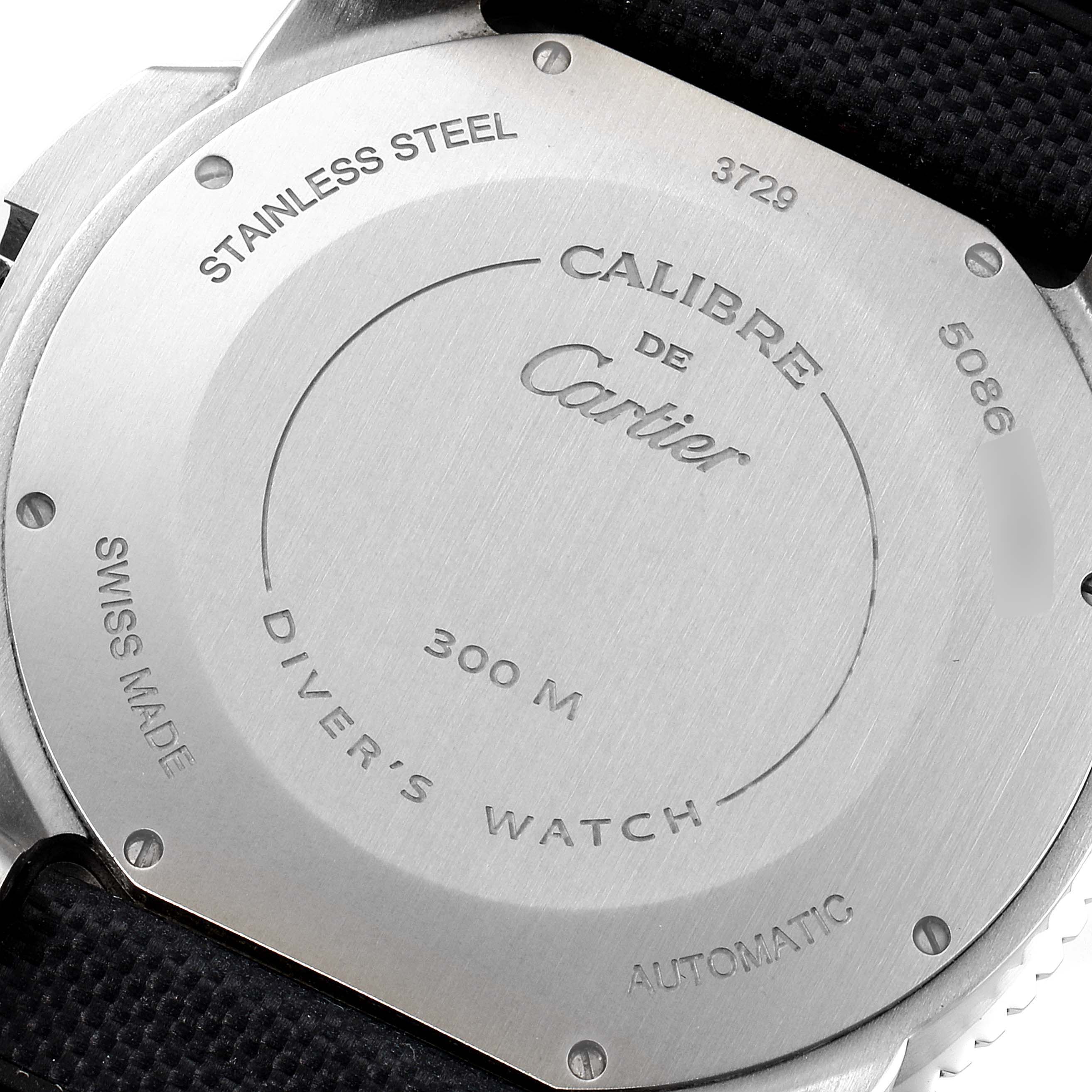 The image shows the backside of a Calibre de Cartier watch by Cartier, highlighting its stainless steel case and model information.