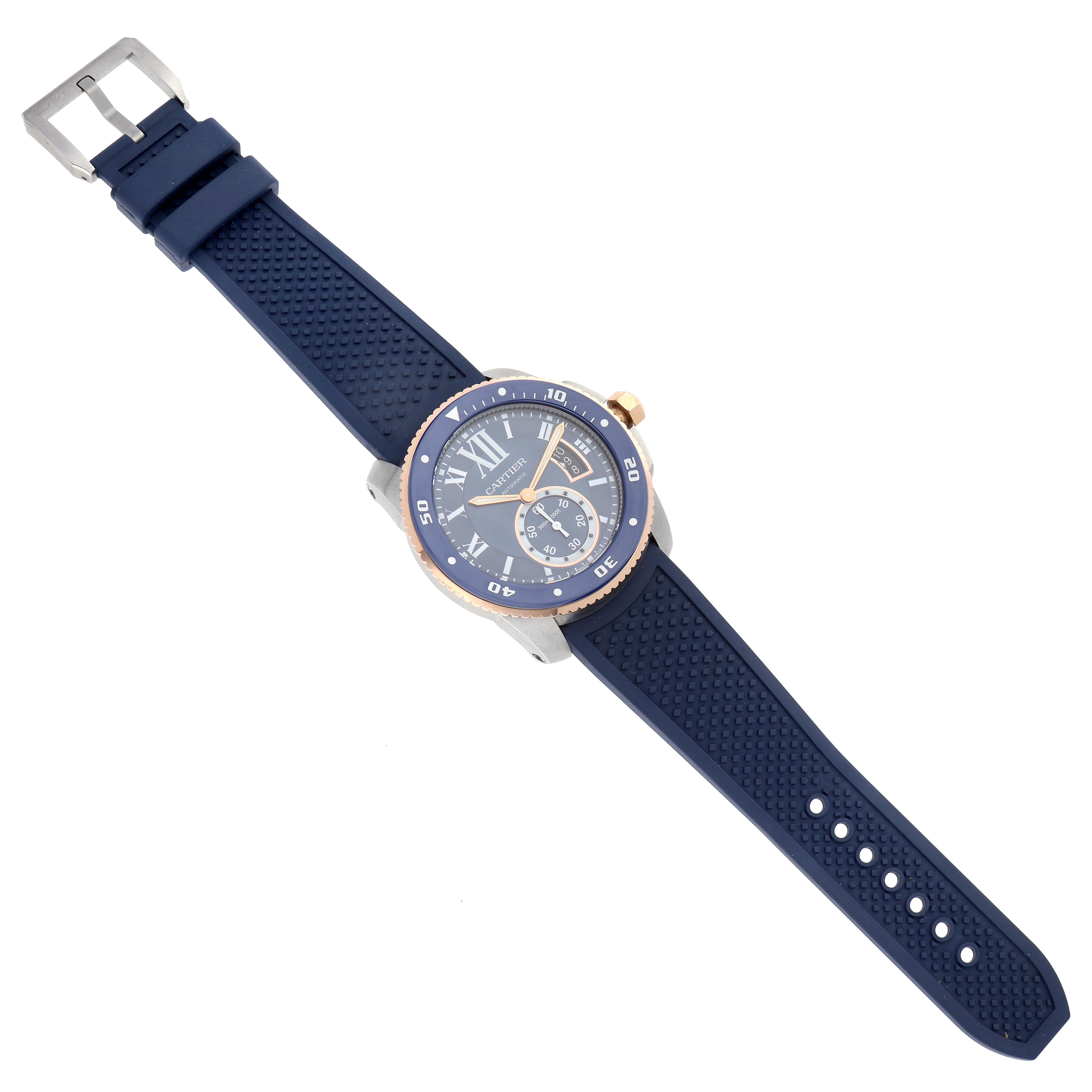 The Calibre de Cartier watch is shown from a top view, displaying the face, bezel, strap, and buckle.