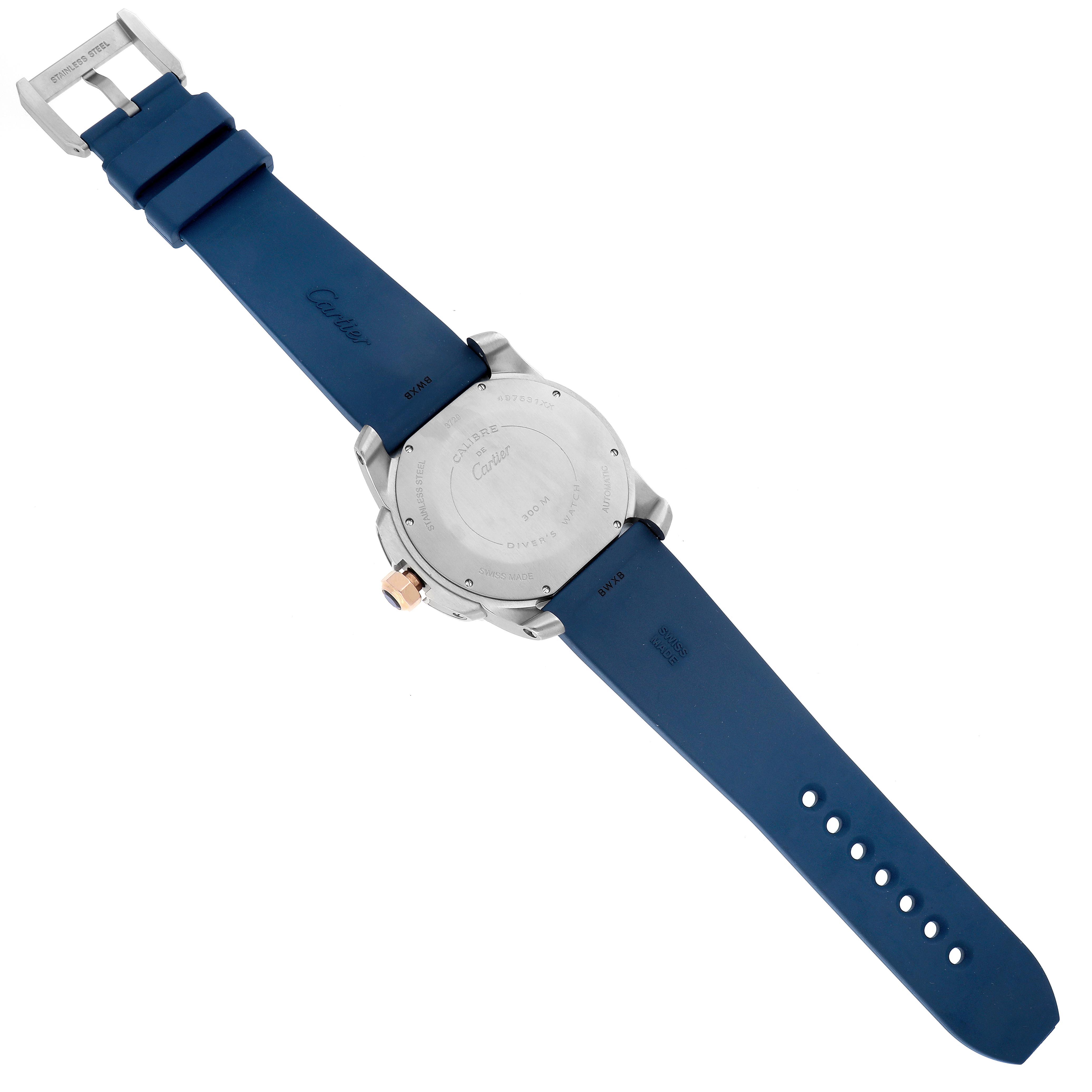 The Calibre de Cartier watch is shown from the back, displaying the case back and blue strap with buckle.