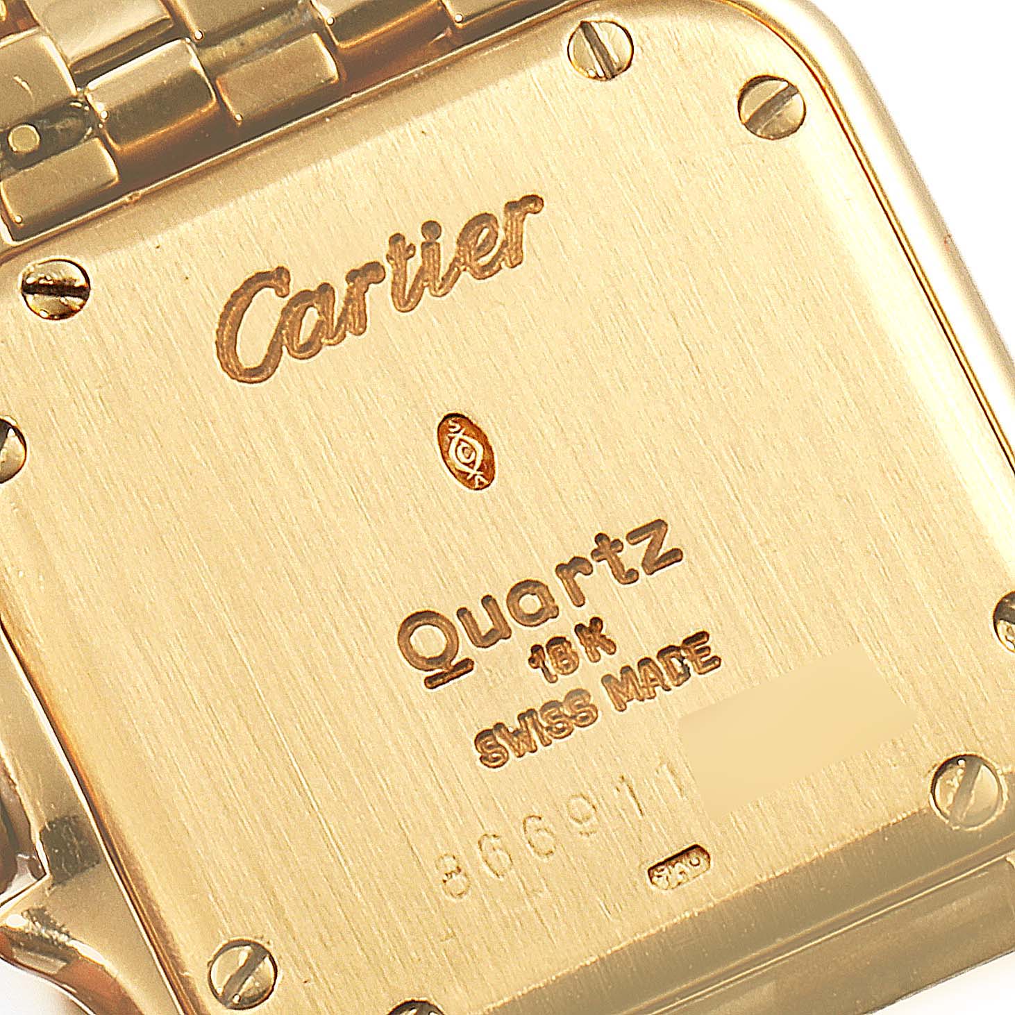 This image shows the back of a Panthere model by Cartier, focusing on the engraved details and screws.