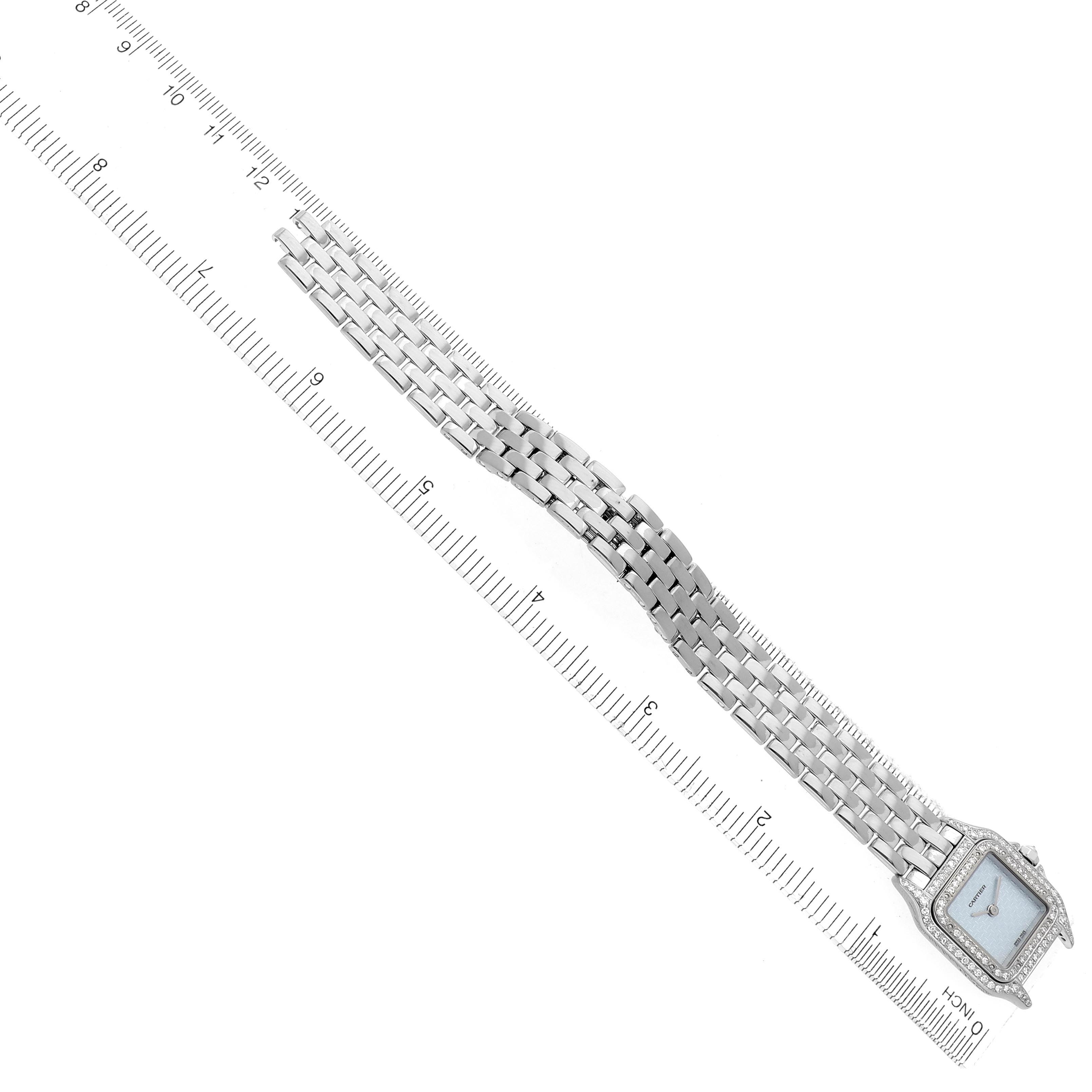 The Cartier Panthere WF3249F3 Women
s White Gold Blue Dial WF3249F3 Women
s White Gold Blue Dial watch is displayed flat with its face and full bracelet visible diagonally alongside a ruler for scale.