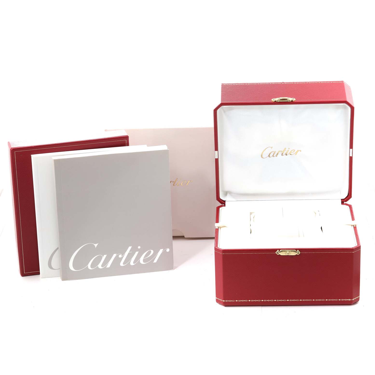 This image shows the Cartier Roadster W62017V3 Women's Stainless Steel Pink Dial W62017V3 Women's Stainless Steel Pink Dial watch's red presentation box and accompanying booklets arranged in front of it.