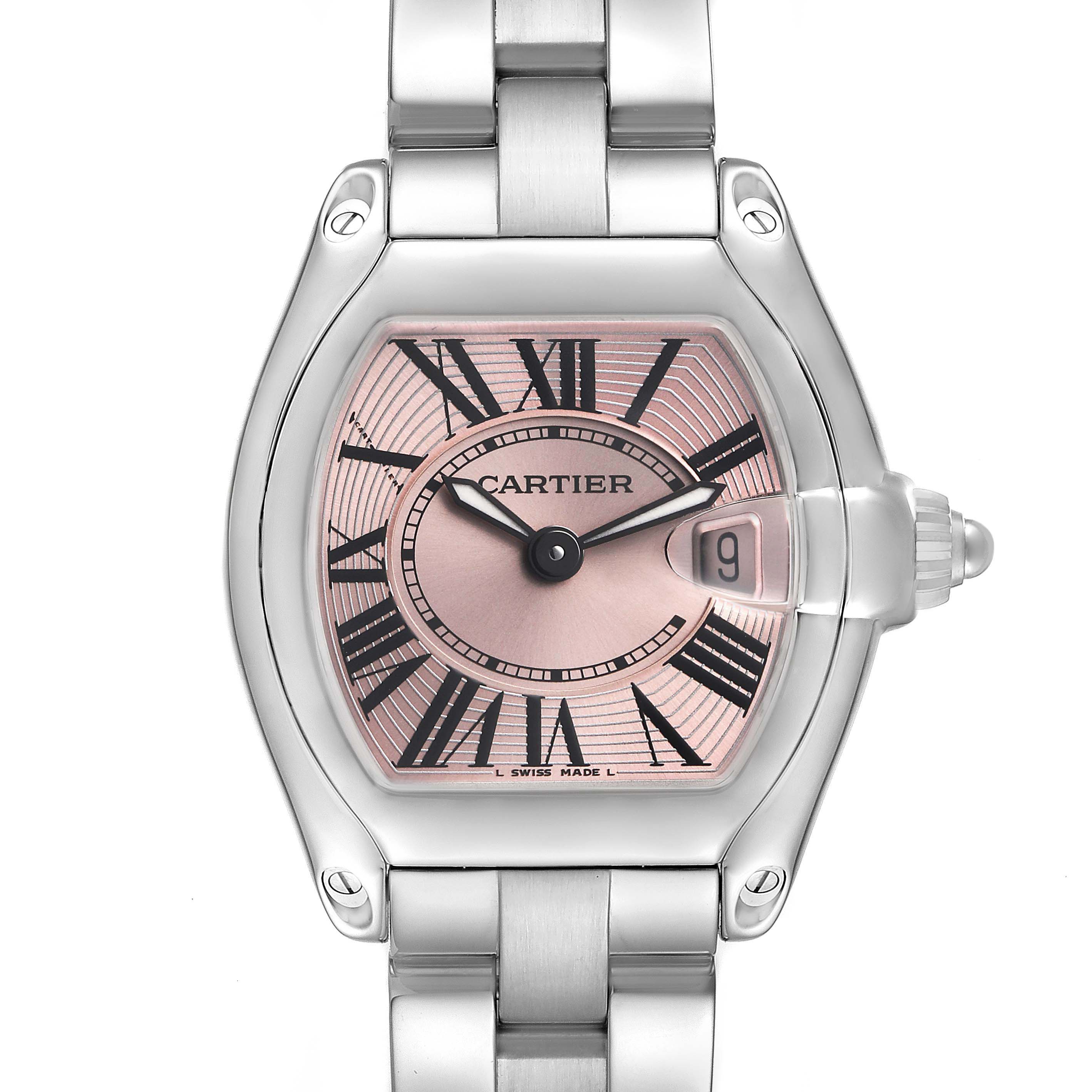 The Cartier Roadster W62017V3 Women's Stainless Steel Pink Dial watch is shown from the front, highlighting its dial, Roman numerals, and bracelet.