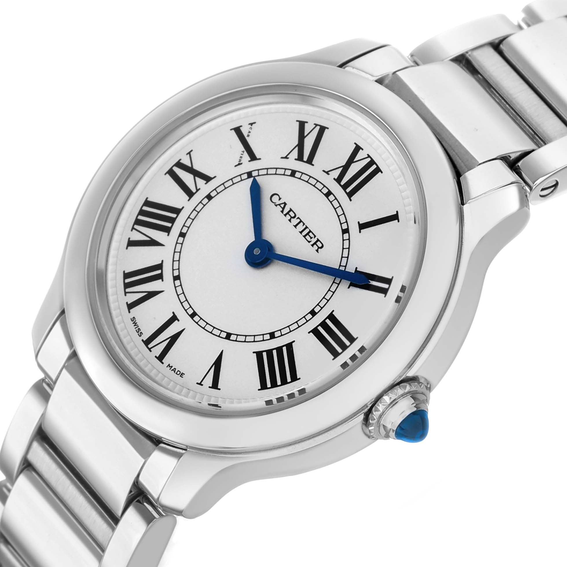 The Cartier Ronde WSRN0033 Women's Stainless Steel Silver Dial watch is shown at a slight angle, displaying its face, Roman numerals, blue hands, metal bracelet, and crown.